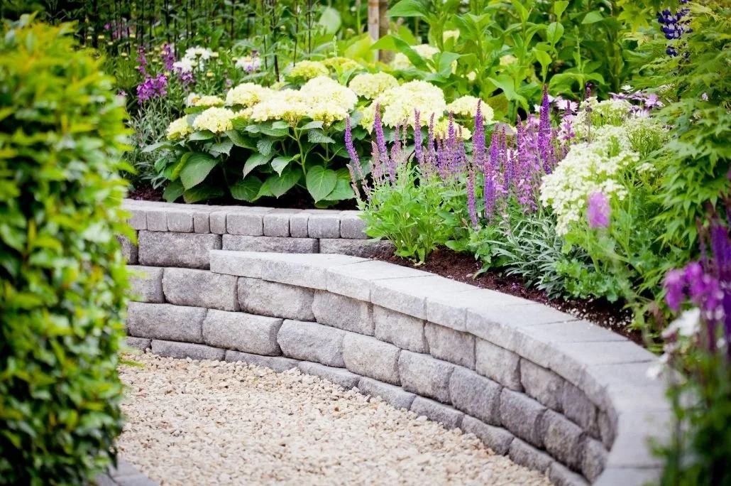 Landscaping stone wall and flower beds