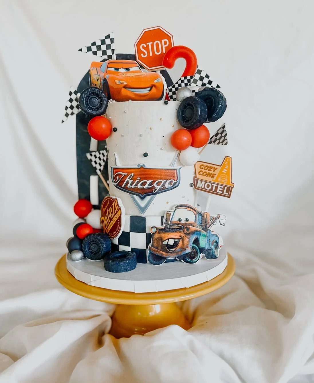 Tall 4&rdquo; cake, inspired by the timeless Disney/Pixar movie, Cars 🏎️ Isn&rsquo;t that road going up the side of the cake so cool?? I made it with fondant, and then put 479 lbs of white chocolate on the back to keep it from falling apart. 😅 

Ha