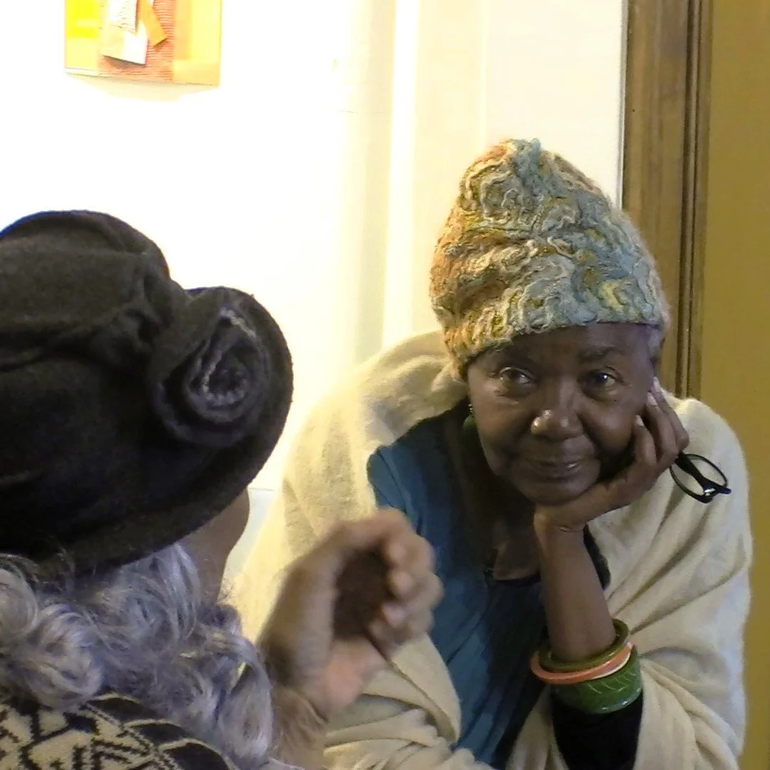 Sheila Crider listening to art patron