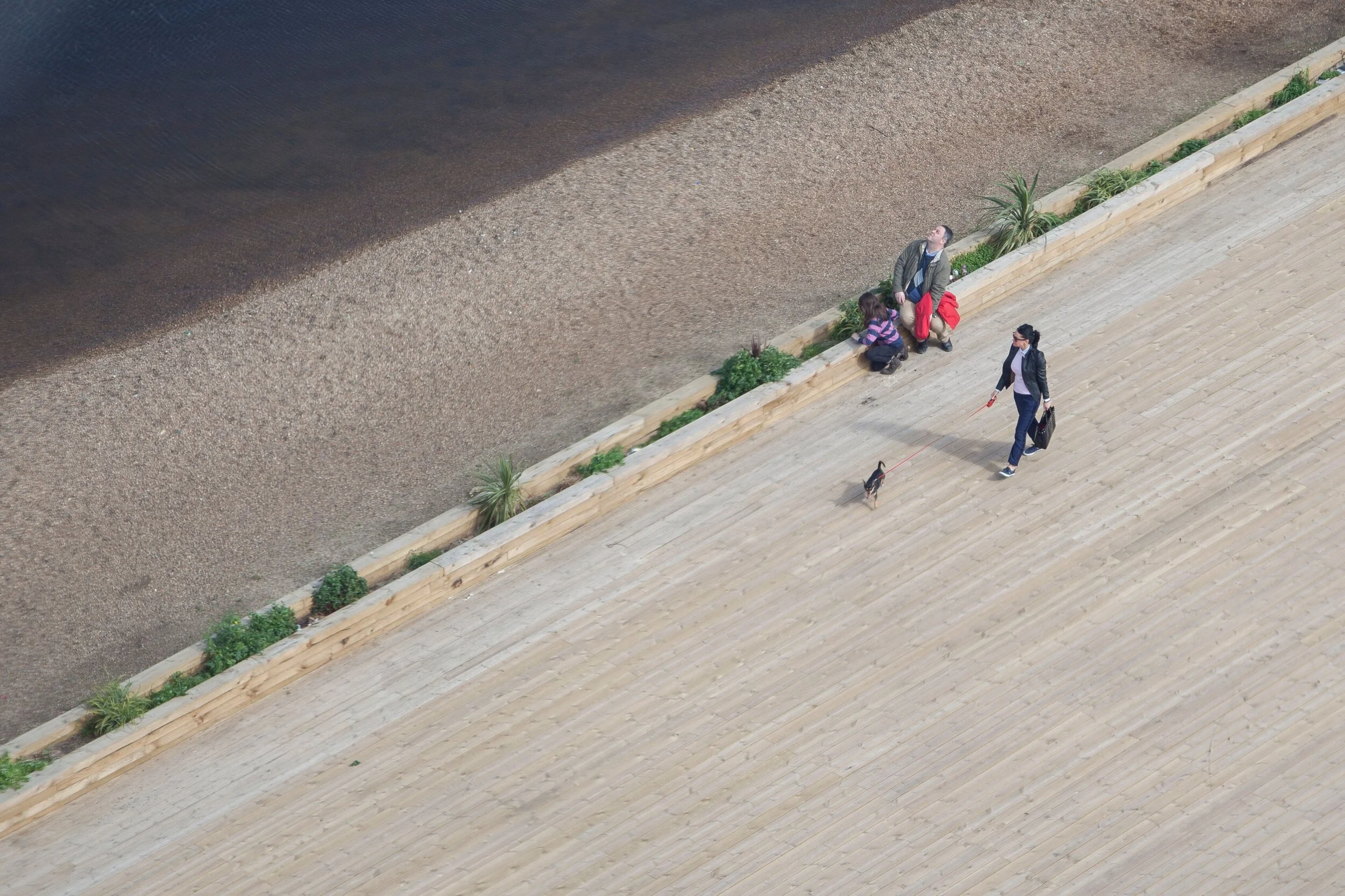 image of a street which has a man looking up on it