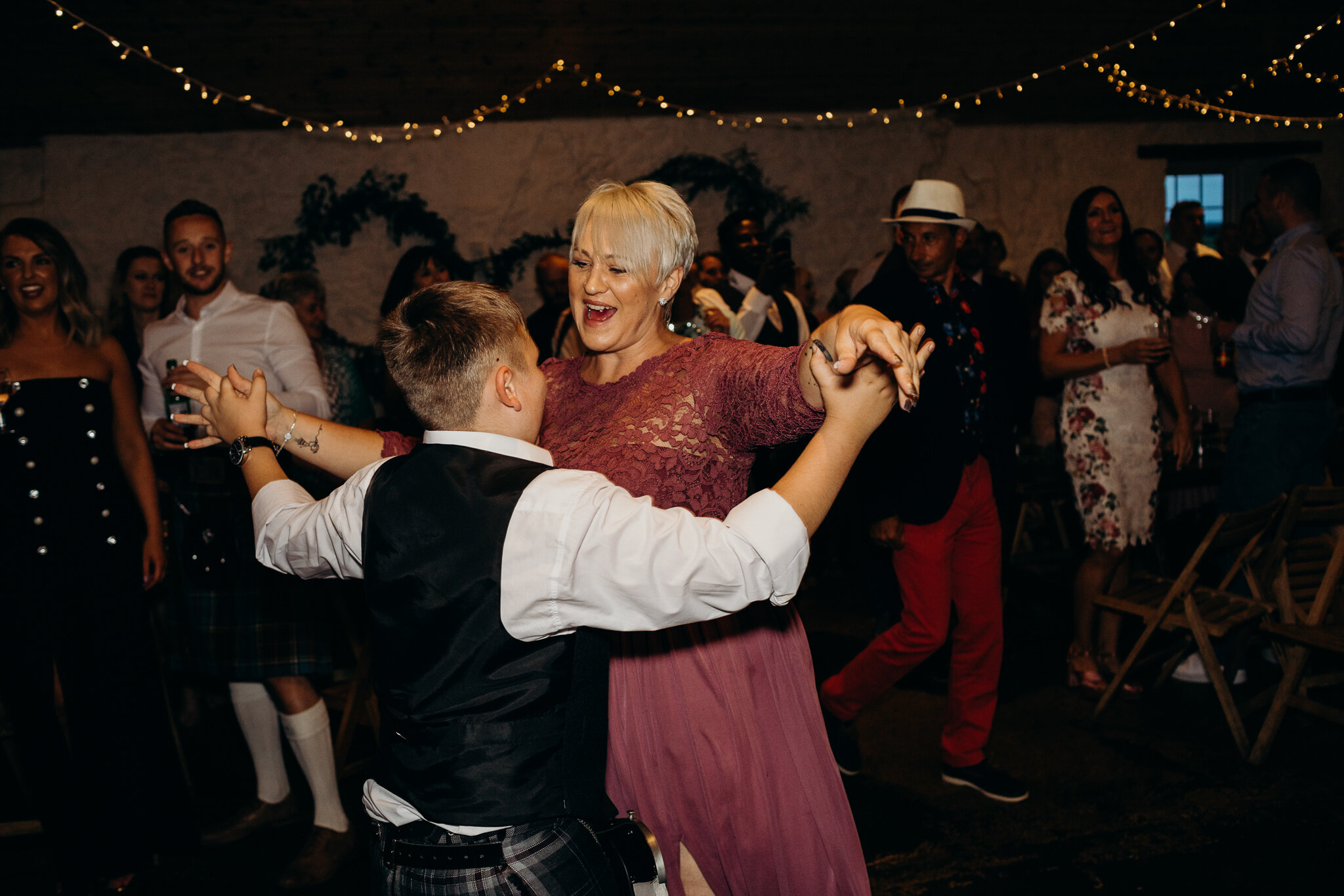 guests dancing at night at barn wedding dance at dalduff farm photographed by wedding photographer ayrshire Scotland