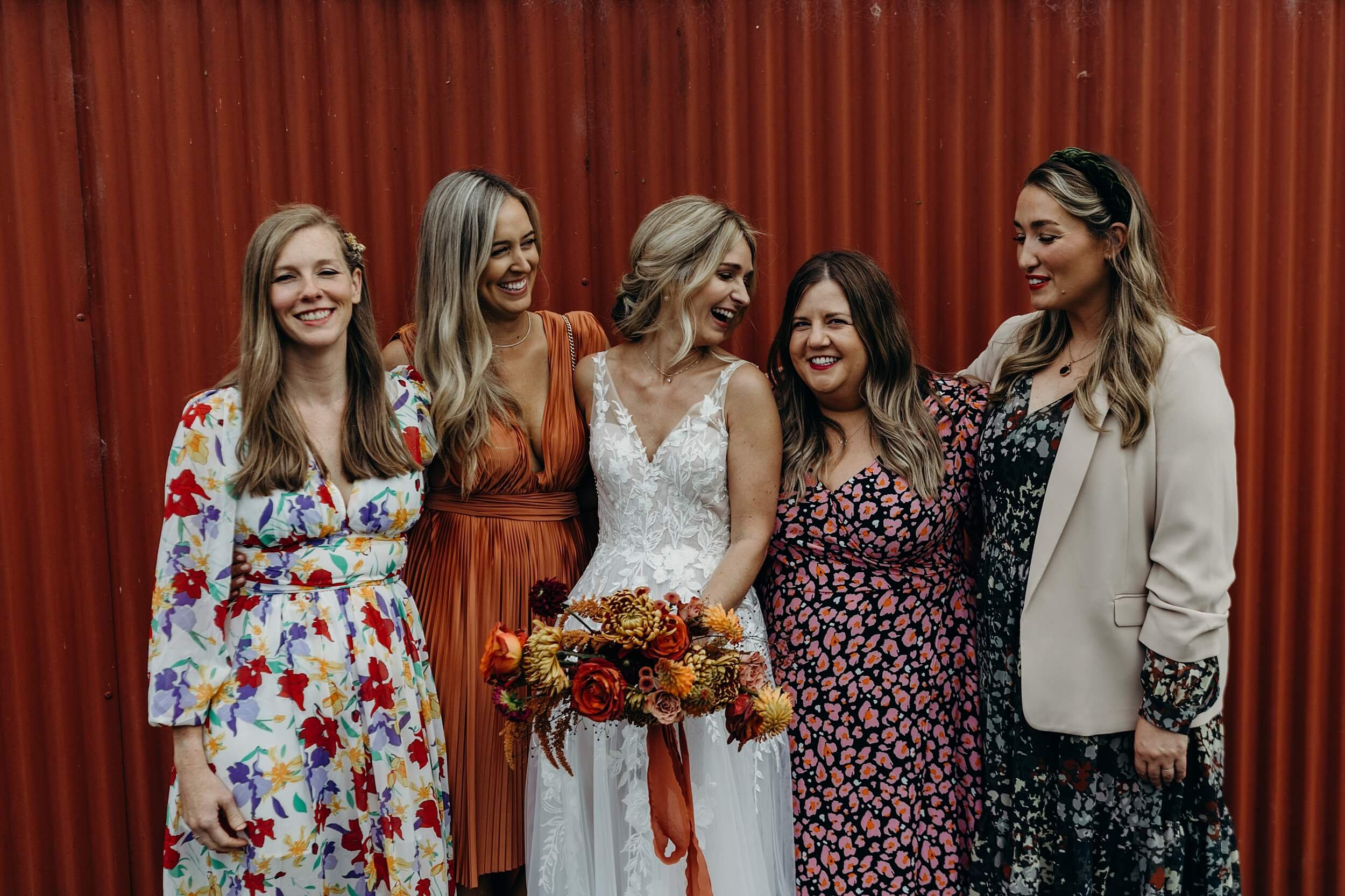 bride and her friends laugh together during group photos natural wedding photography glasgow scotland