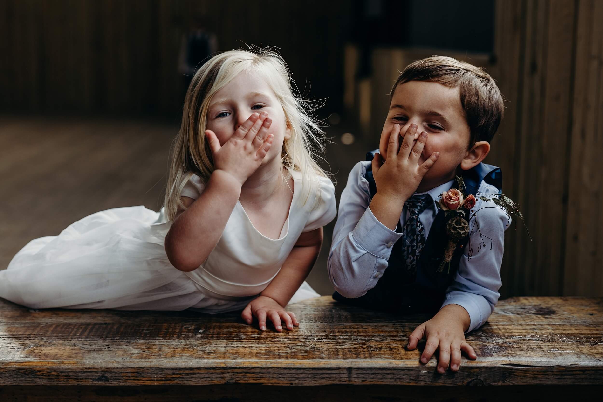 kids blow kisses to the natural wedding photography glasgow scotland on wedding day