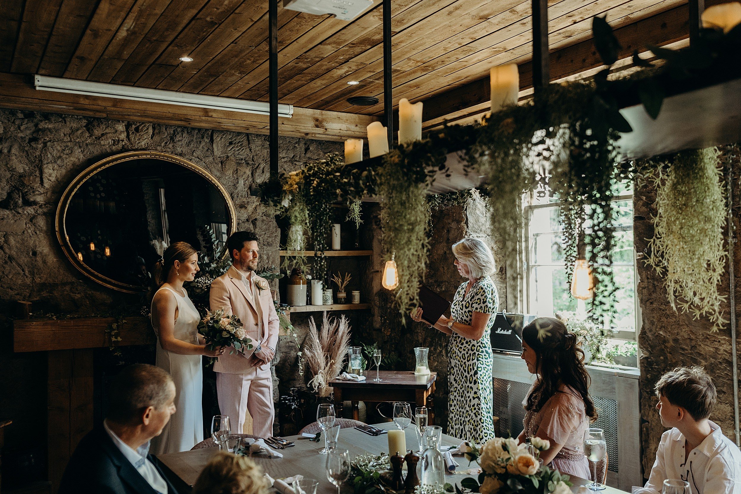 bride and groom getting married in the scullery at the bothy glasgow wedding with their celebrant Susan Mathieson