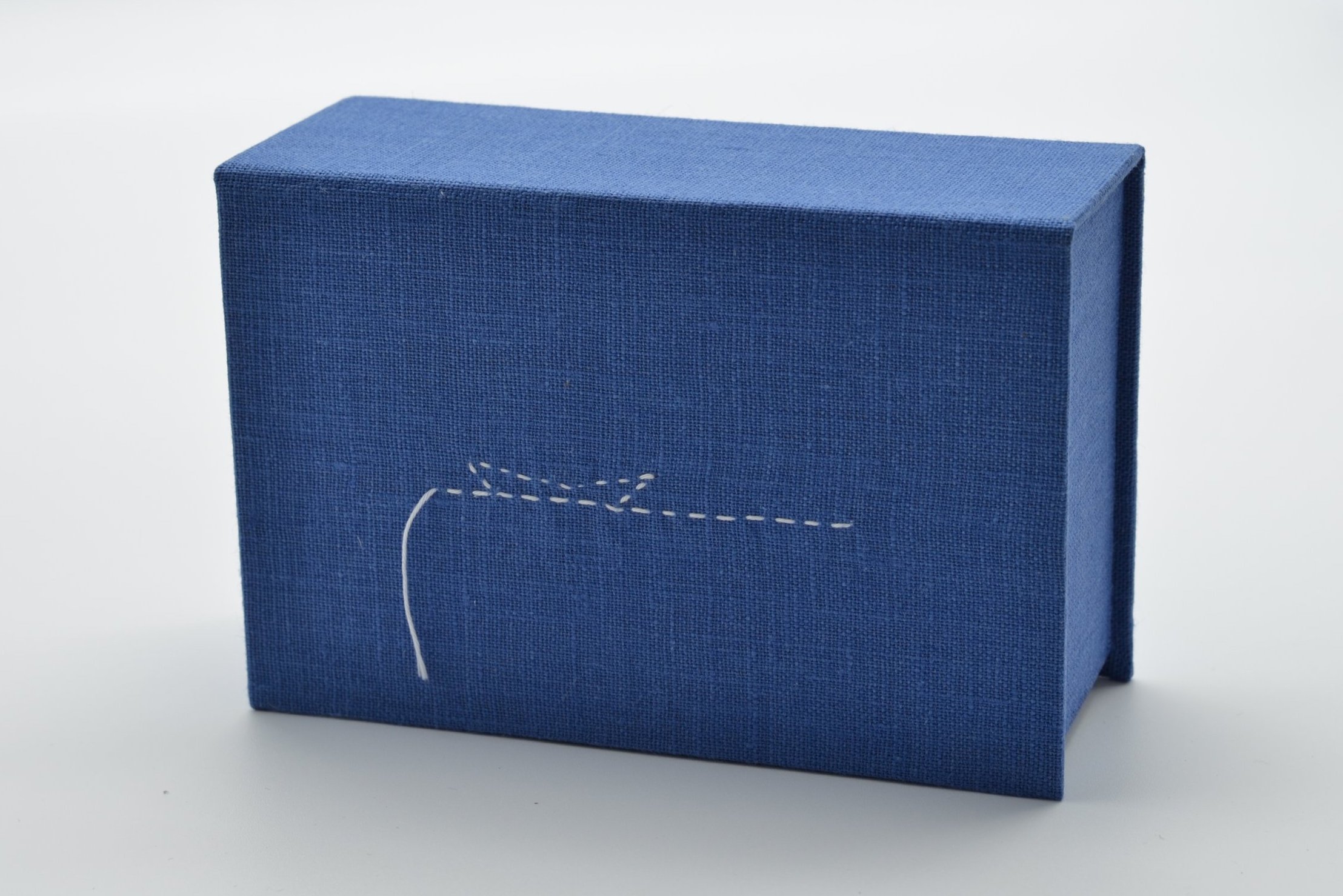 Unravel (detail - clamshell box)