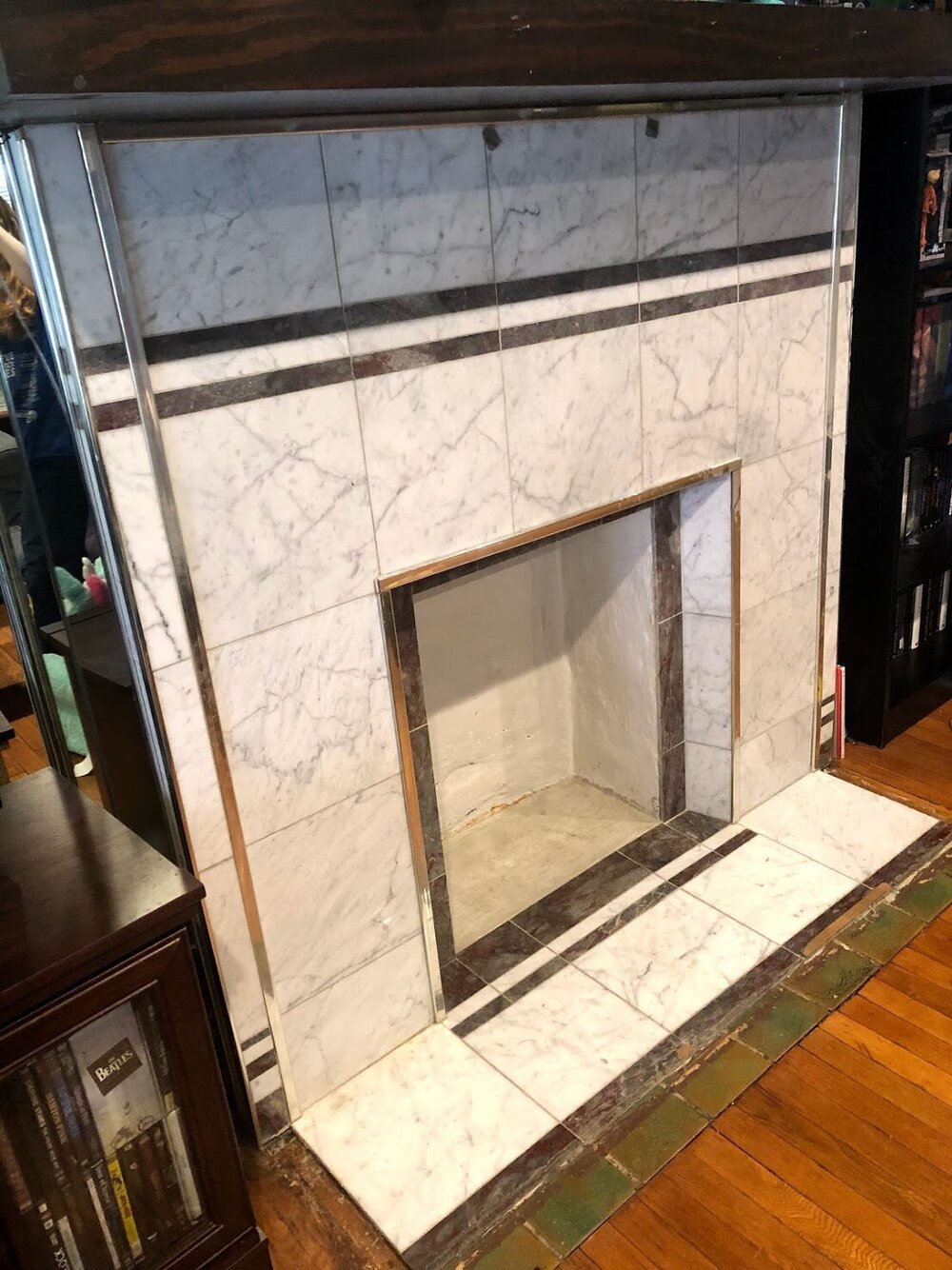  Look at this ugly ass 1980’s fireplace that is covering some beautiful 1917 terra-cotta tiles. Just ripe for the dismantling!  