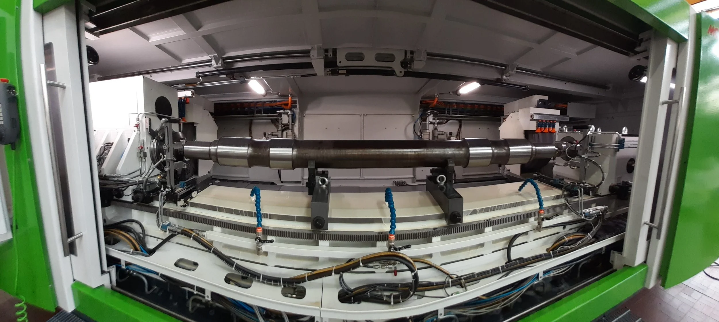 Grinding machine for Railway axle finished in GRINDING TECHNOLOGY SRL at Cassine (Italy) facility