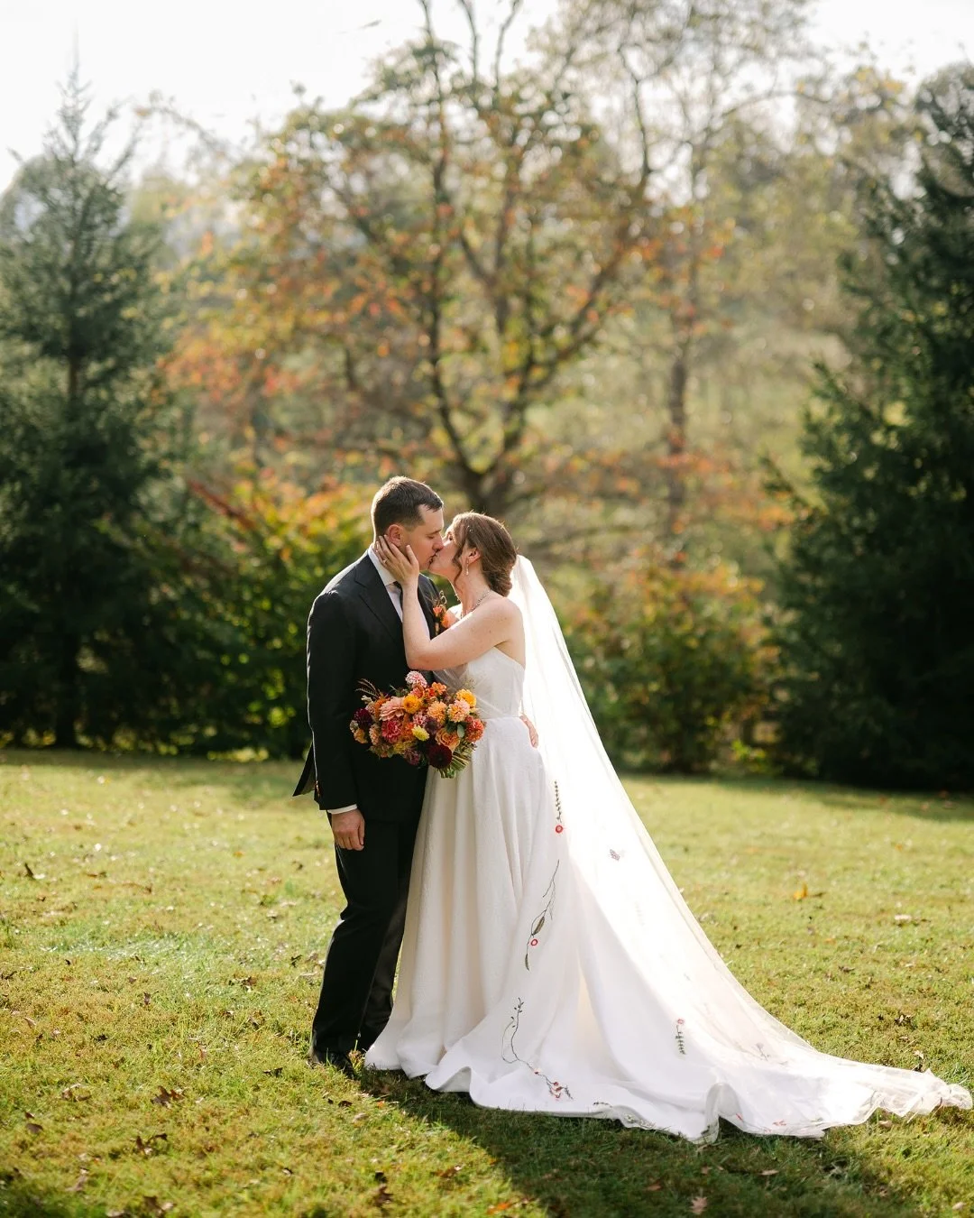 After I pretty rainy year, early fall in Asheville gifted us the kind of day you dream about. The skies held steady and the sun wrapped everything in golden light.

She wore a veil embroidered with delicate blooms and they said &ldquo;I do&rdquo; ben