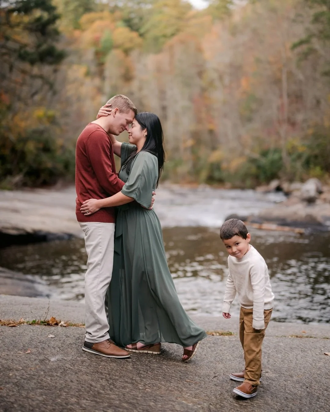 This family originally planned their photo session last fall, but Hurricane Helene had other plans. They waited patiently, and this season gave them everything—crisp fall colors, a stunning waterfall backdrop, and the sweetest little boy who li