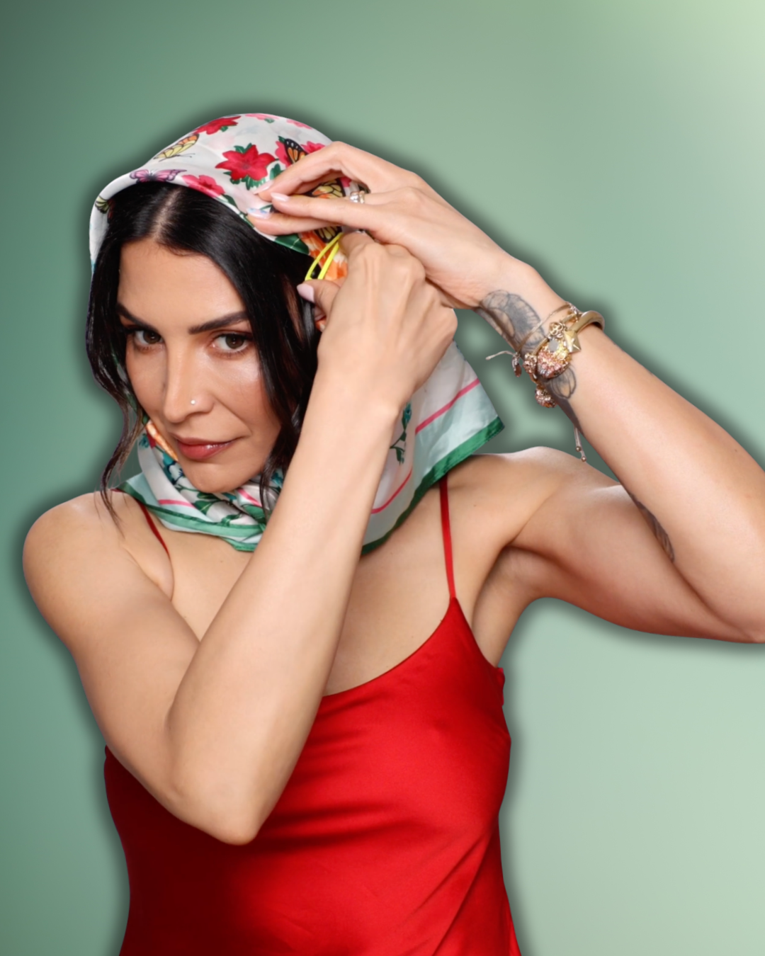 gabi styling her head scarf demonstrating clipping the sides of the scarf to her hair to prevent slipping