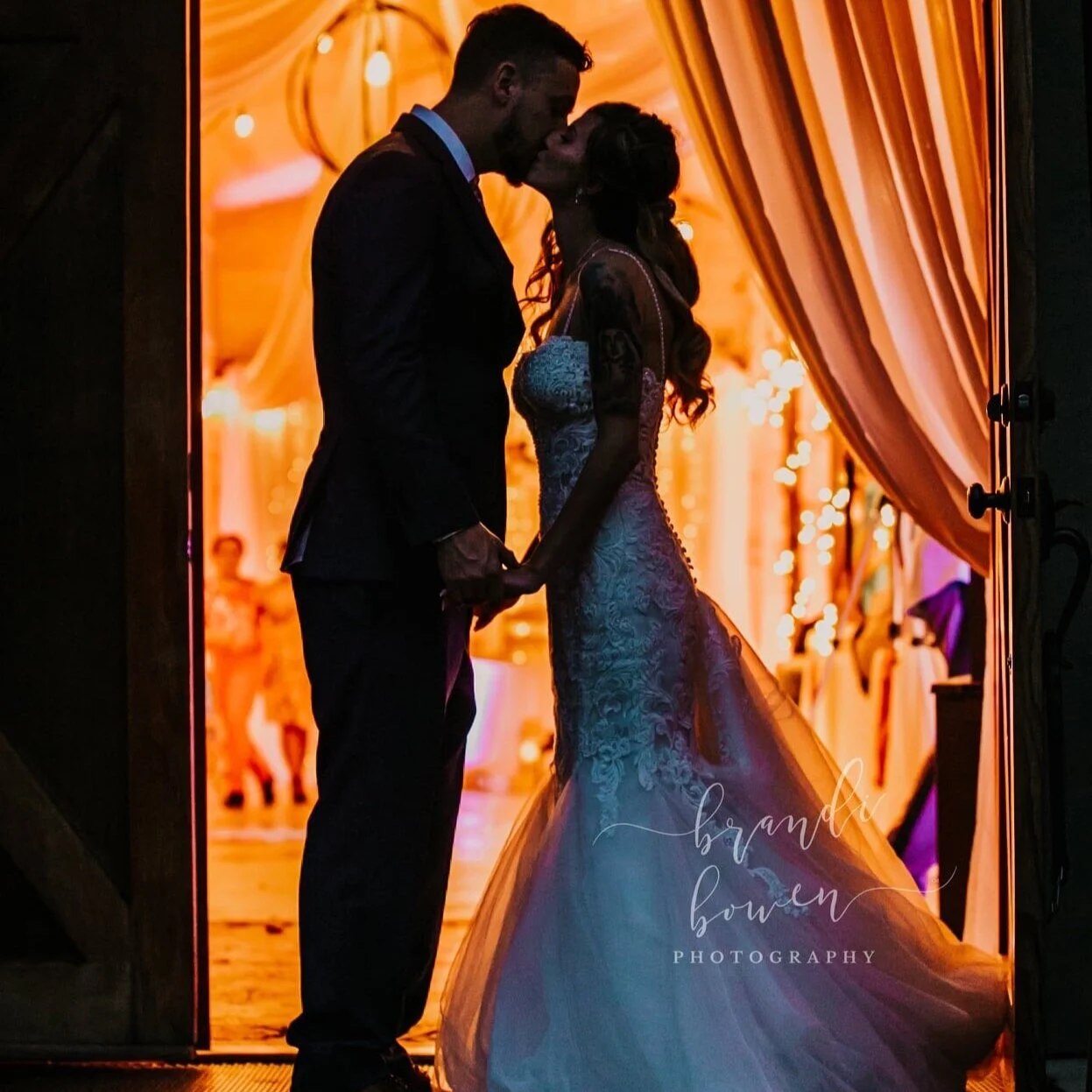 Glowing night silhouette of wedding couple at The Catlett Farm in Fayetteville NC