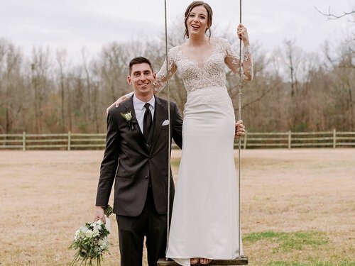 Winter-Bride-Stands-on-Swing-Tall-Groom.jpg