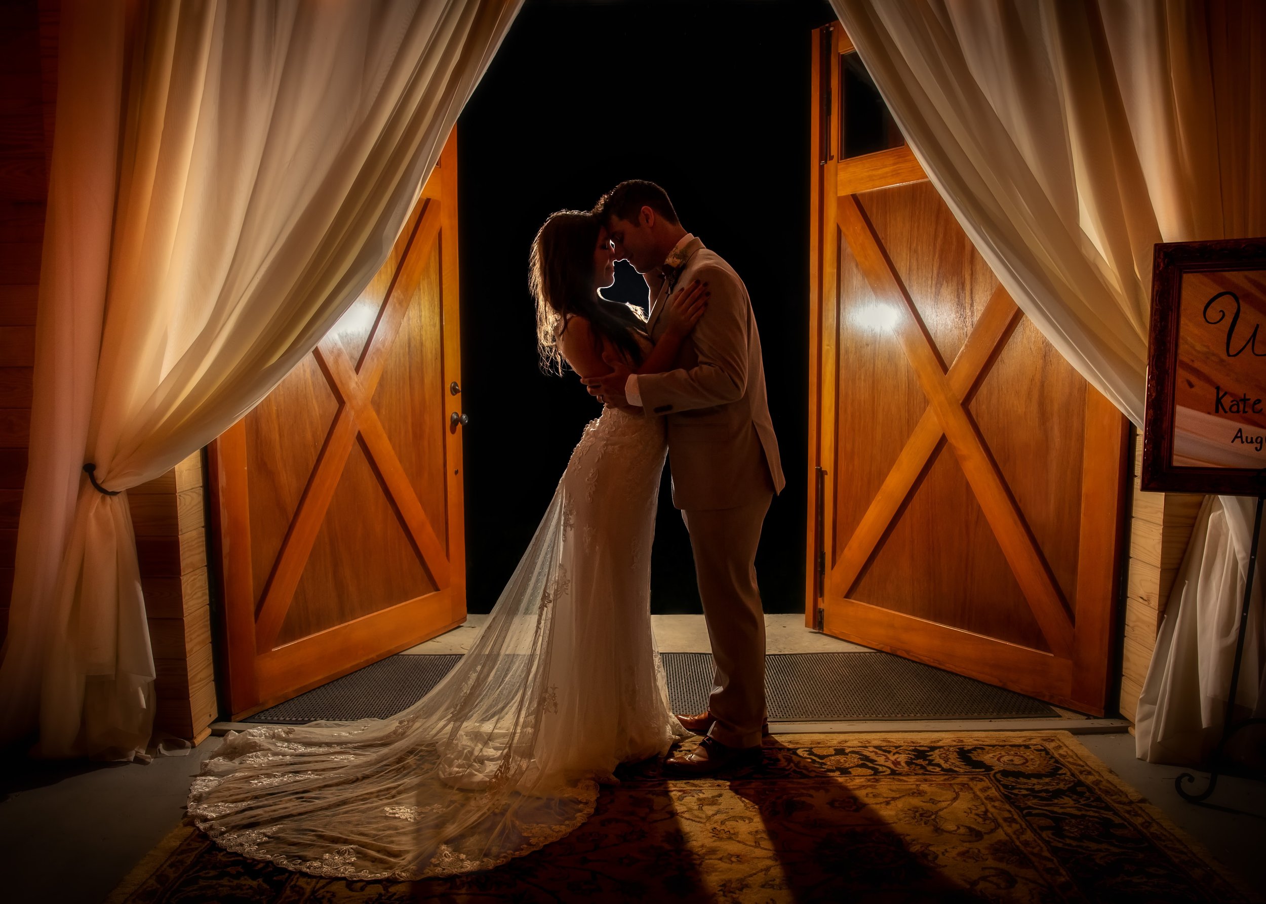 Wedding-Couple-Dramatic-Night-Pose-Curtains-Doors.jpg