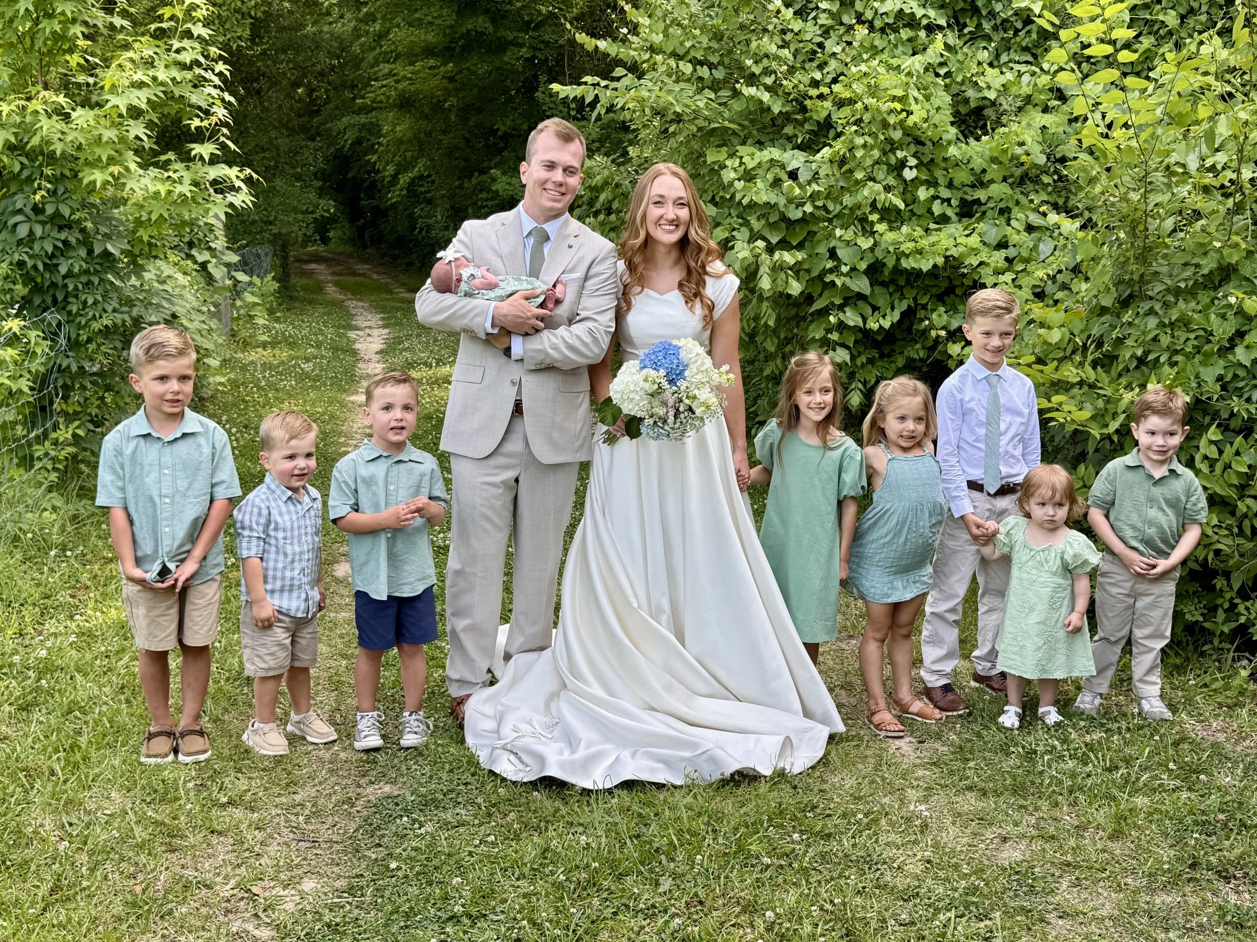 Bridal-Couple-Nieces-Nephews-Wooded-Road-.jpg