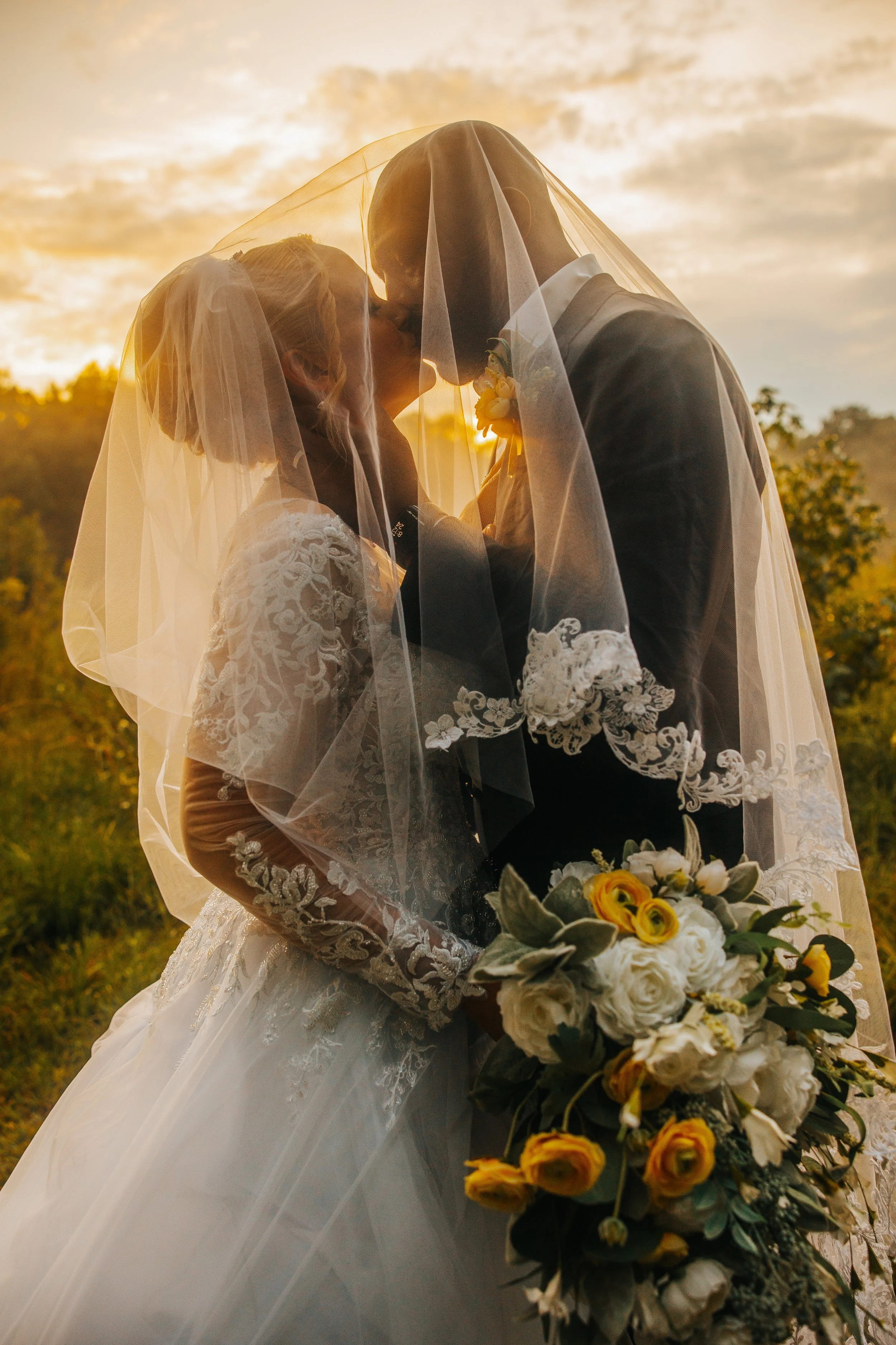 Sunset-Wedding-Kiss-Through-Veil-Brandi-.jpg