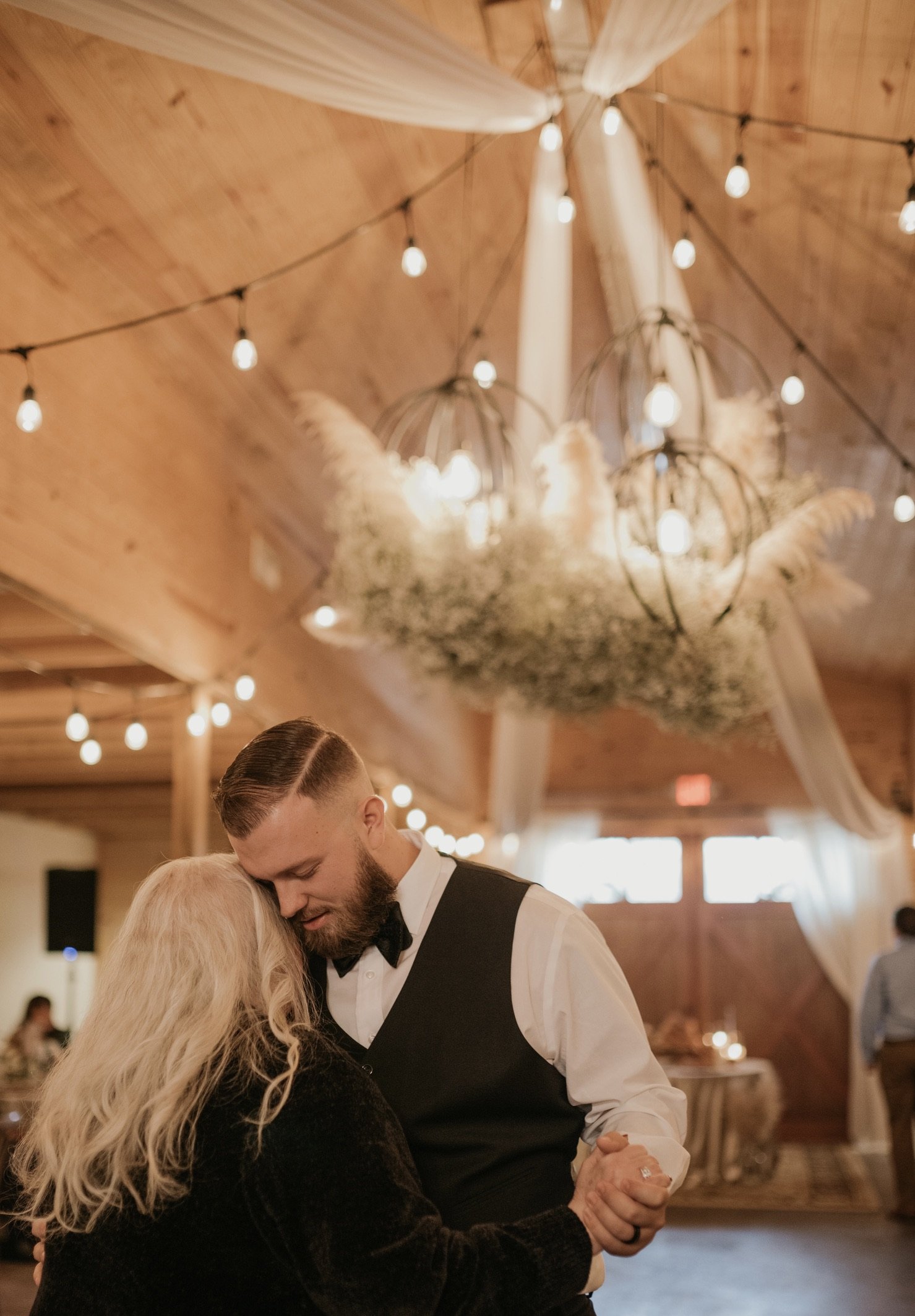 Groom-Dances-Mom-Ceiling-Florals-Catlett-Farm-.jpg