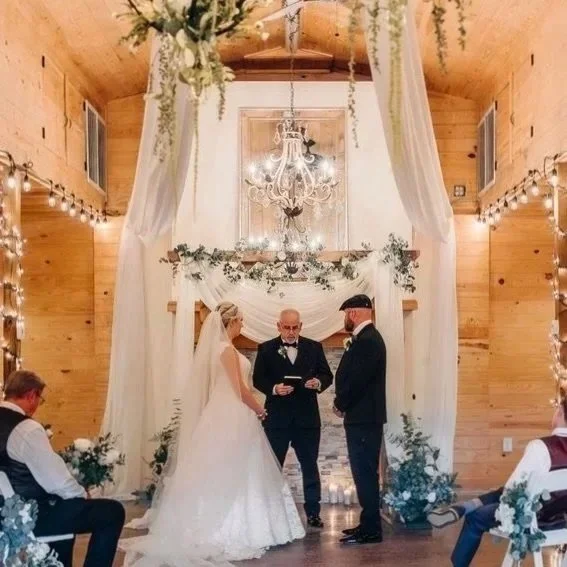 Draped and sparkly indoor wedding ceremony at The Catlett Farm in Fayetteville NC