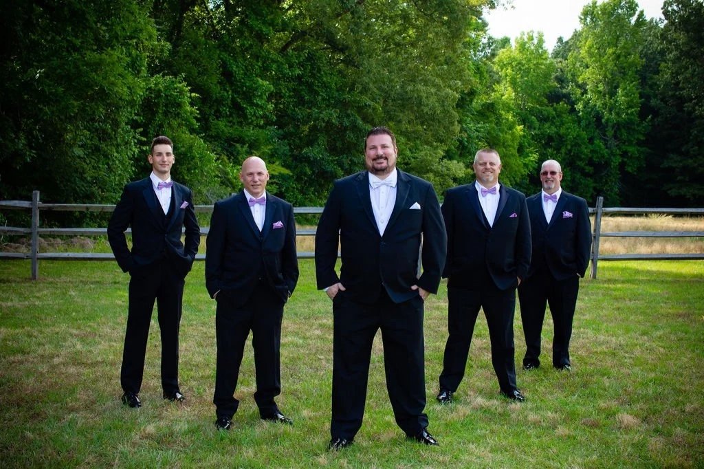 Dark-Formal-Groom-Groomsmen-In-Violet-Bowties.jpg