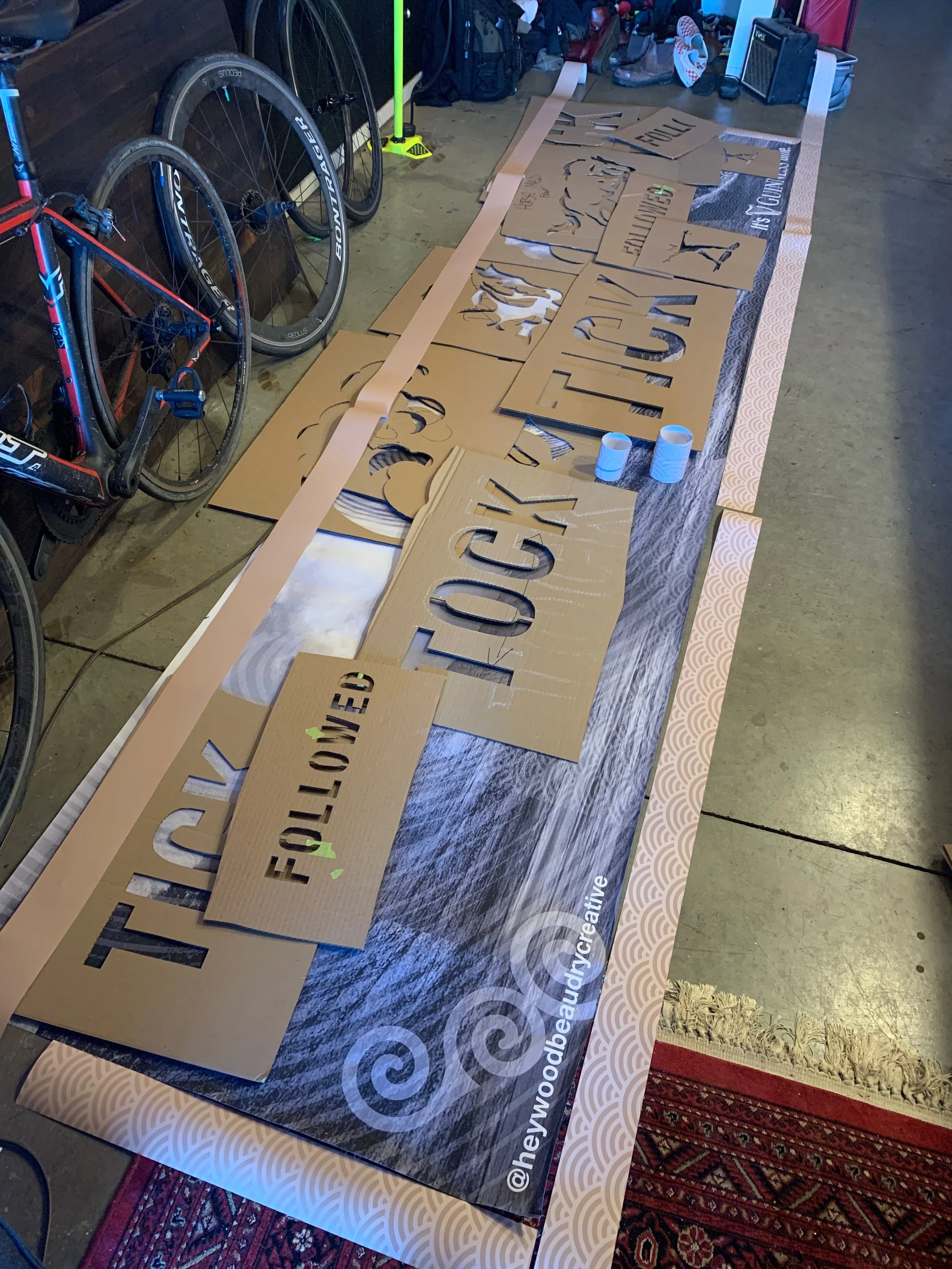 Guinness printed mural artwork and stencils laid out during production