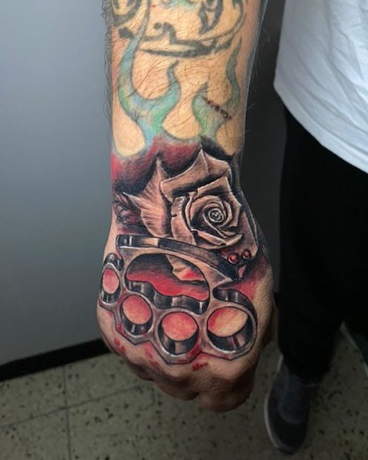 Brass knuckles &amp; rose combo by Alex!🌹

Alex specializes in large scale realism tattoos &amp; loves to add pops of colour! Fill out a free consultation form with the link in our bio to book in with @alex.zh.tattoo ⚡️

📍Oshawa, ON
☎️905-725-0301
