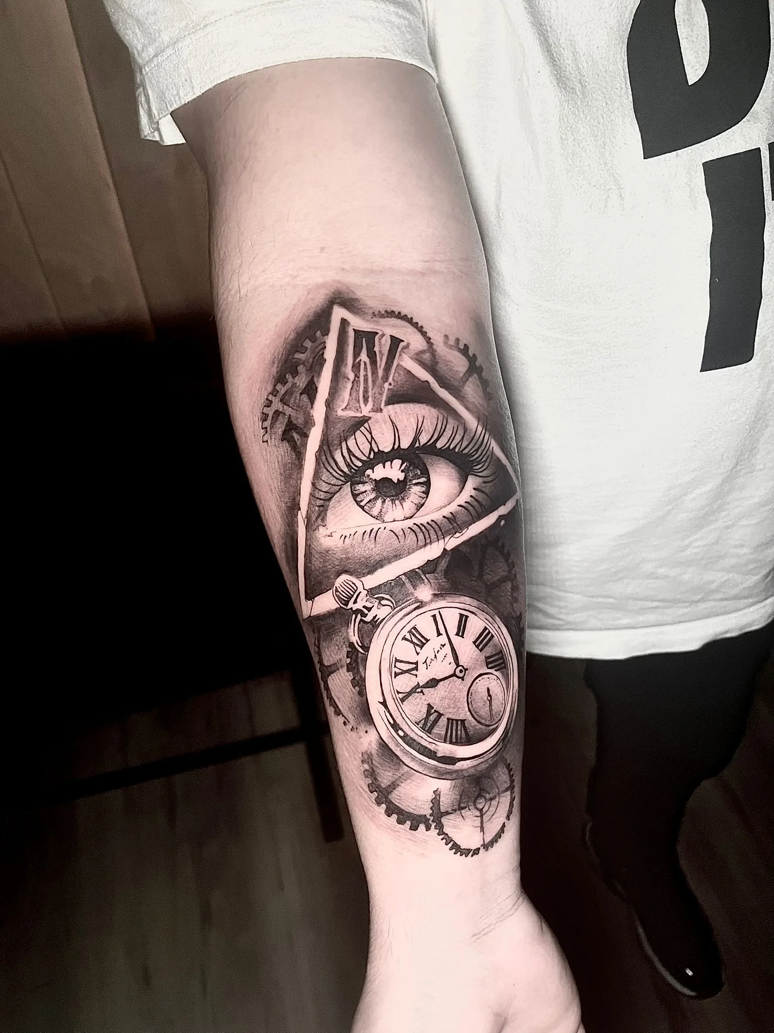 Black & grey realism eye and clock tattoo in Oshawa, Ontario.