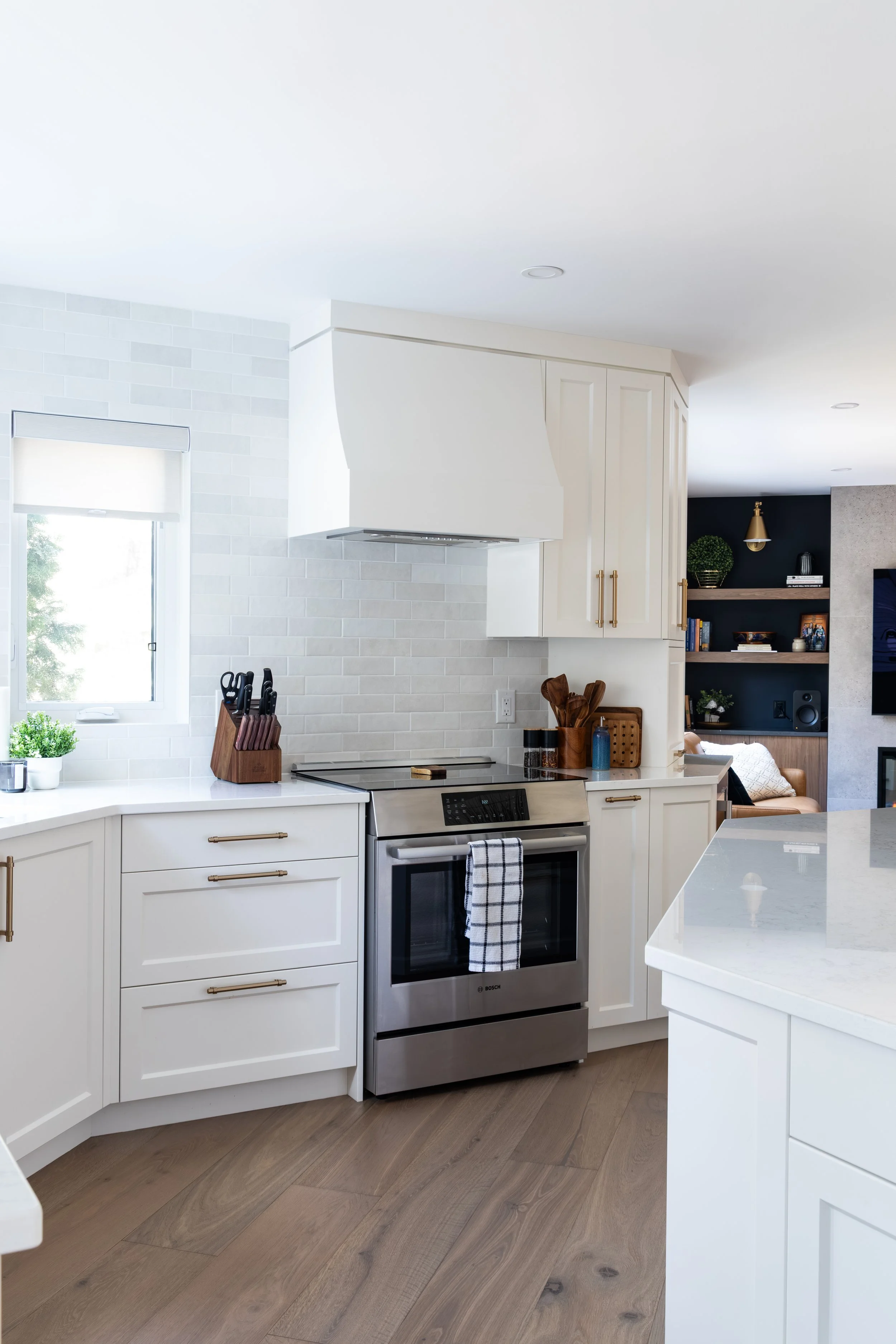 Renovated Kitchen- MDF Painted Cabinets in White Dove with custom designed Range Hood
