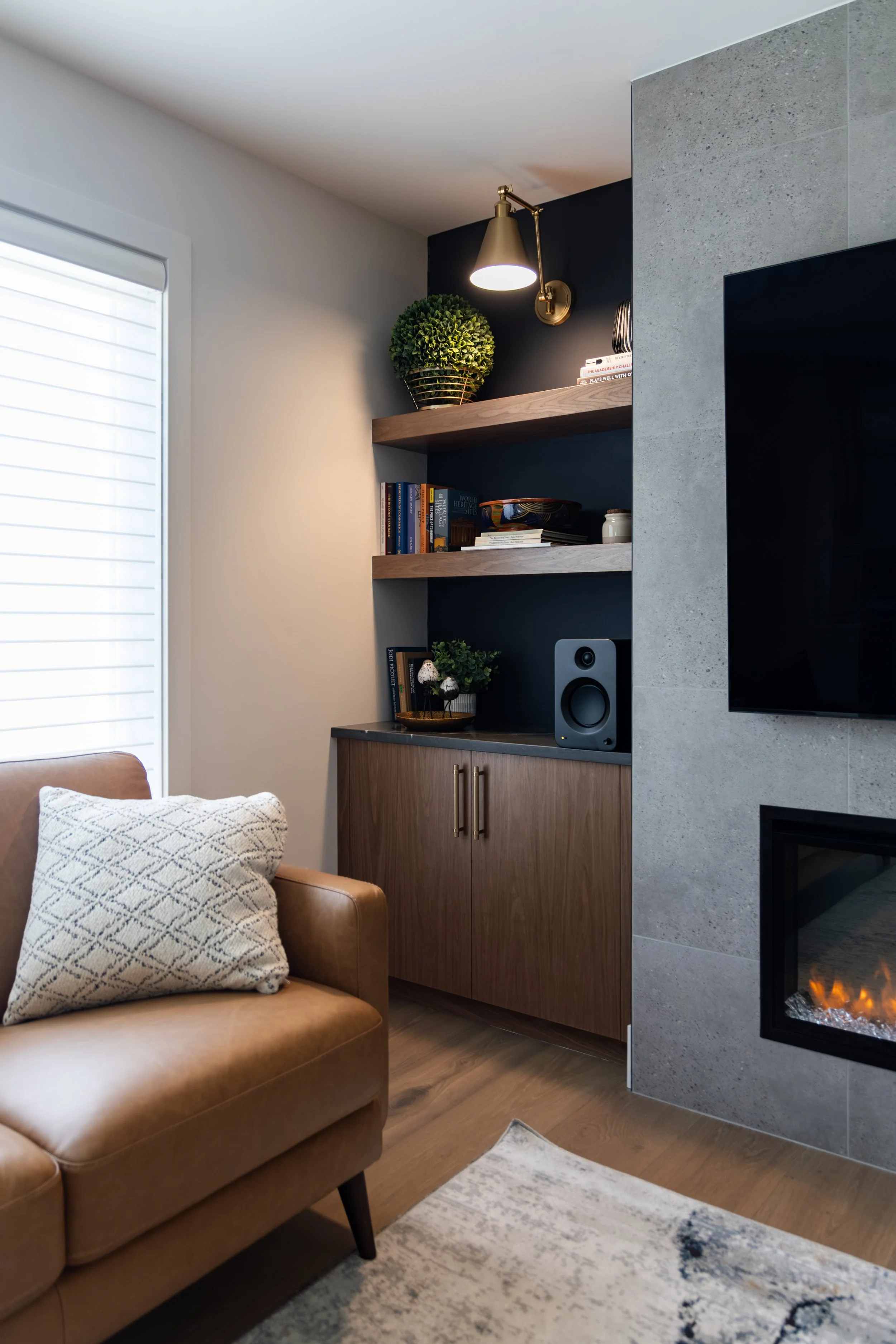 Custom Fireplace with TV Above and built in cabinets and shelves.