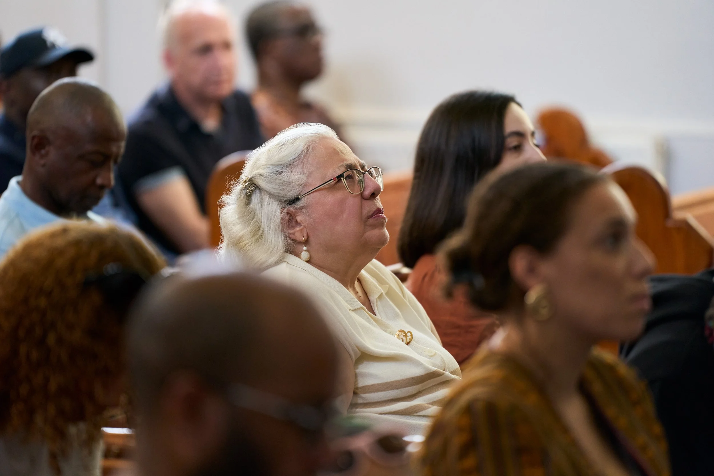 A reflective moment during worship at NPR