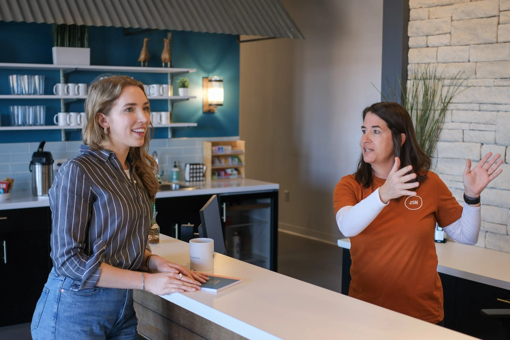 People standing at lobby front desk (frisco).jpg