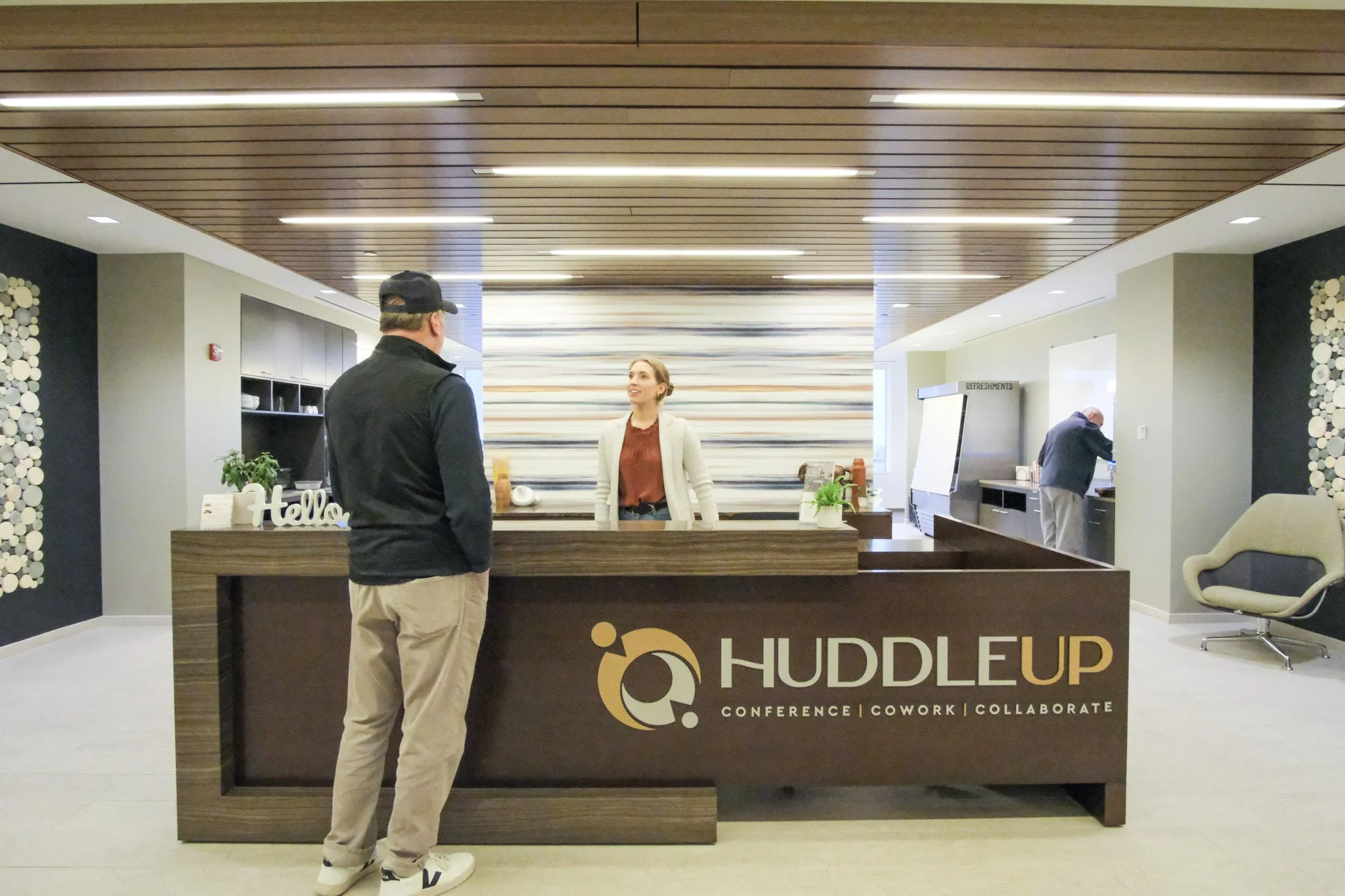 team standing at desk (huddleup).jpg