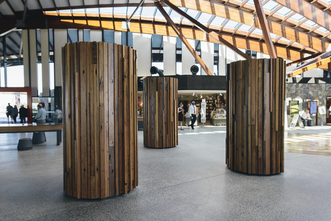 Round pillars covered with timber cladding at the National Convention Centre