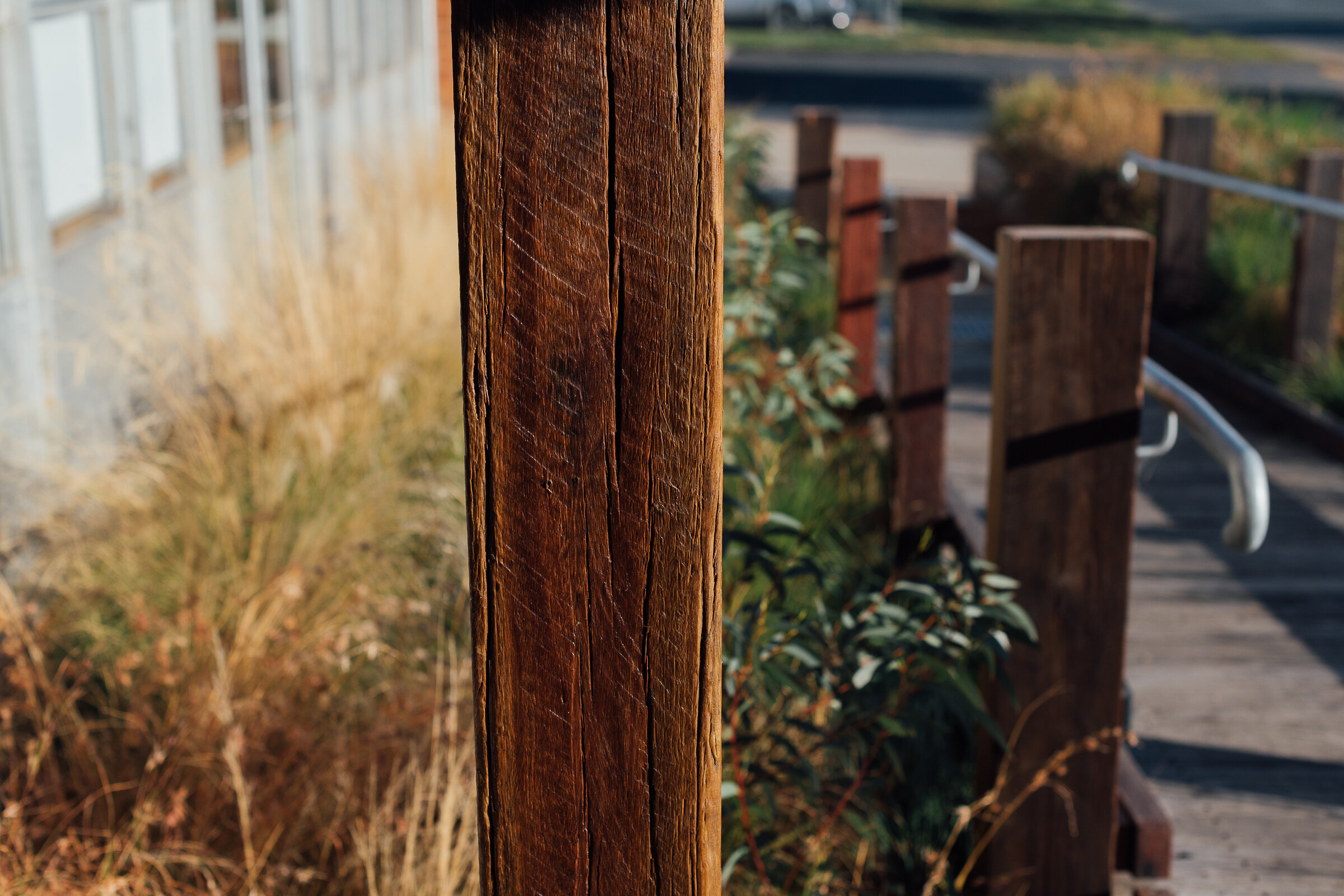 A beautiful, close-up shot of a recycled timber post at the entry of Thor's Hammer showroom