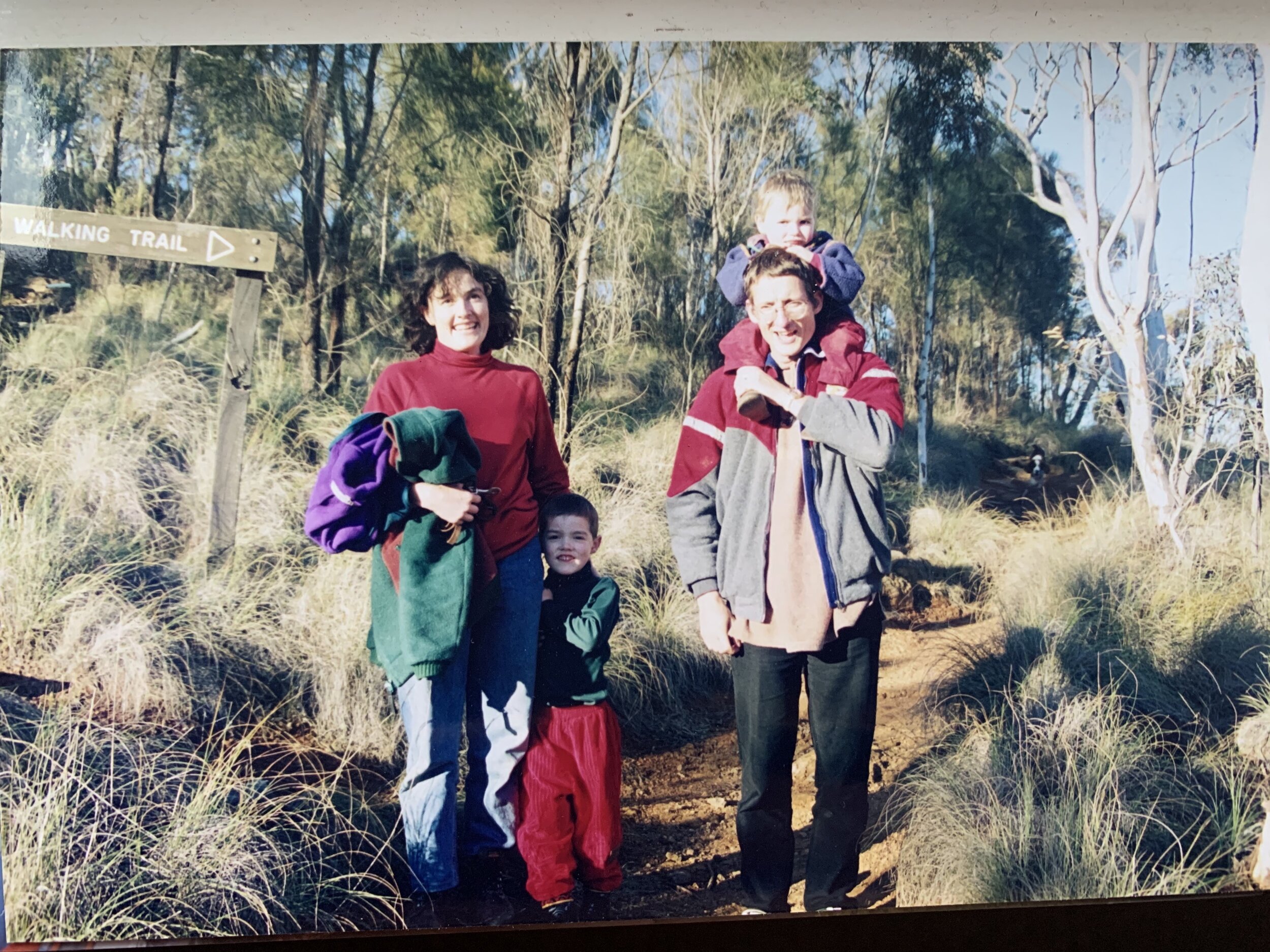  Bushwalking was always a big part of Lachlan’s childhood. Here he is pictured as a child with his parents and family friend. 