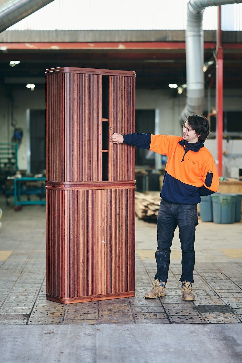 Tambour cocktail cabinet in mixed reds