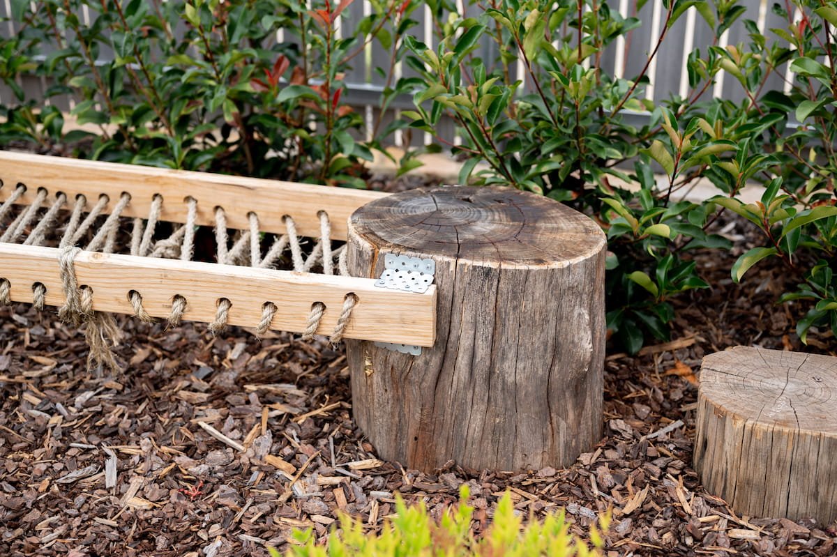 Close-up of the two round posts in the children's obstacle course in a garden