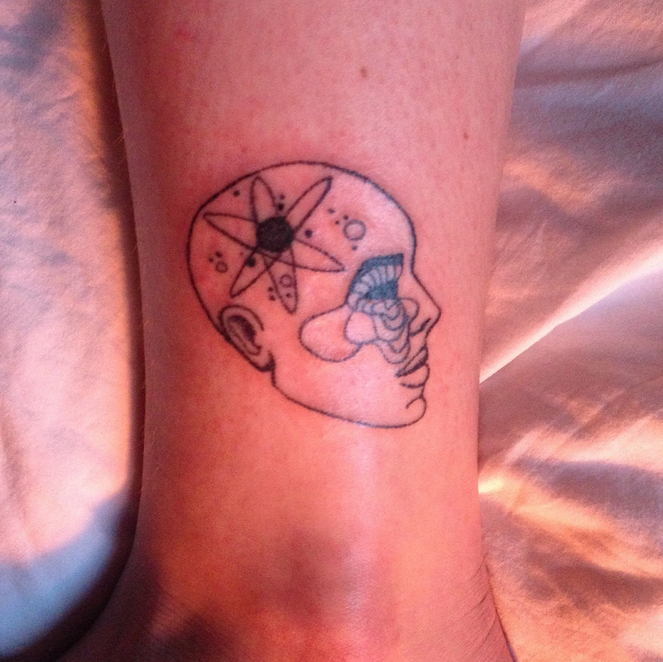 SARRITAH TATTOO _ HANDPOKE COSMIC HEAD.jpg