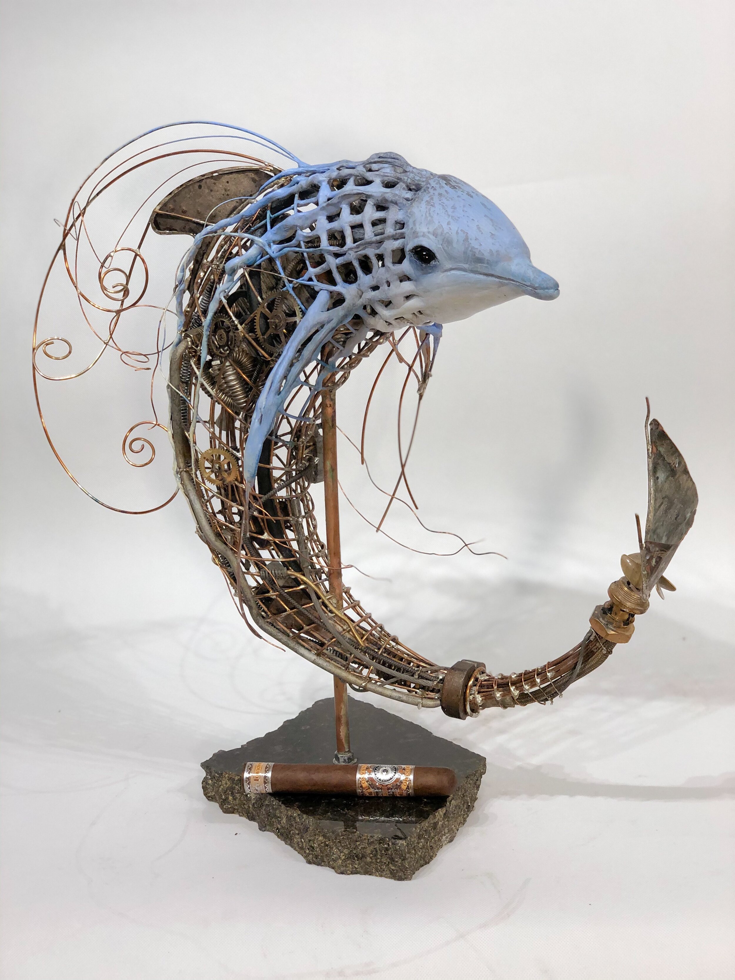    Dolphin  , 19” x 10” x 19”, found objects and clay 