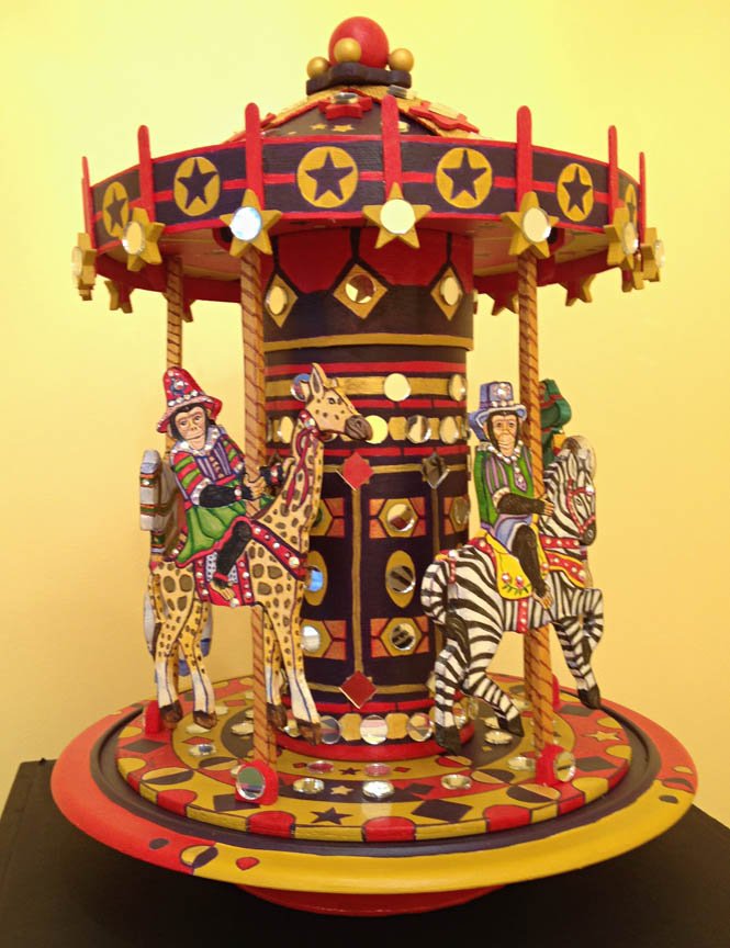    Carousel  , 13”H x 9”D, mixed media, mirrors, crystals 