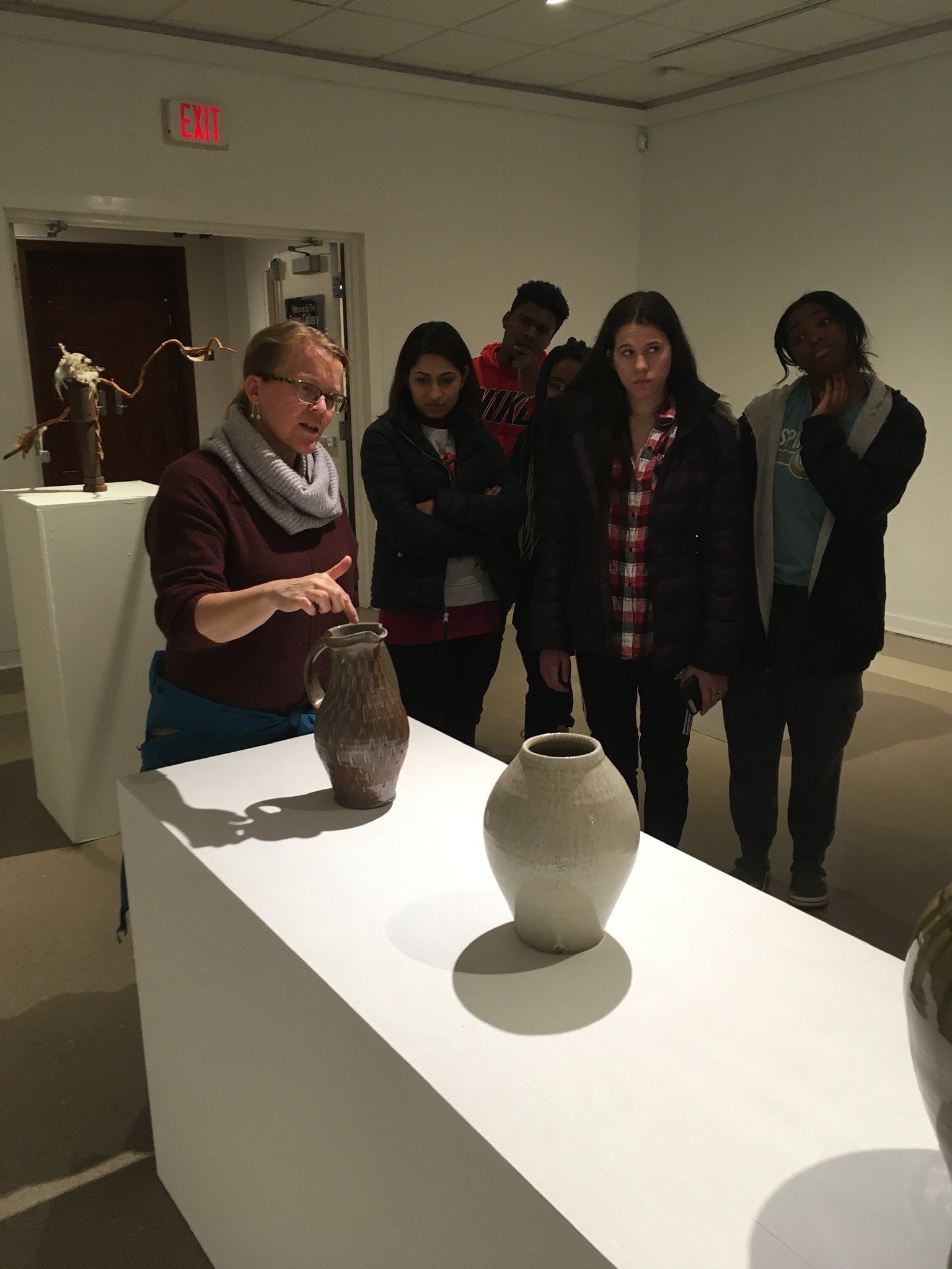  Professor Lis Smith with students at the show  Fired Up in the Natural State: Contemporary Ceramics , 2020 