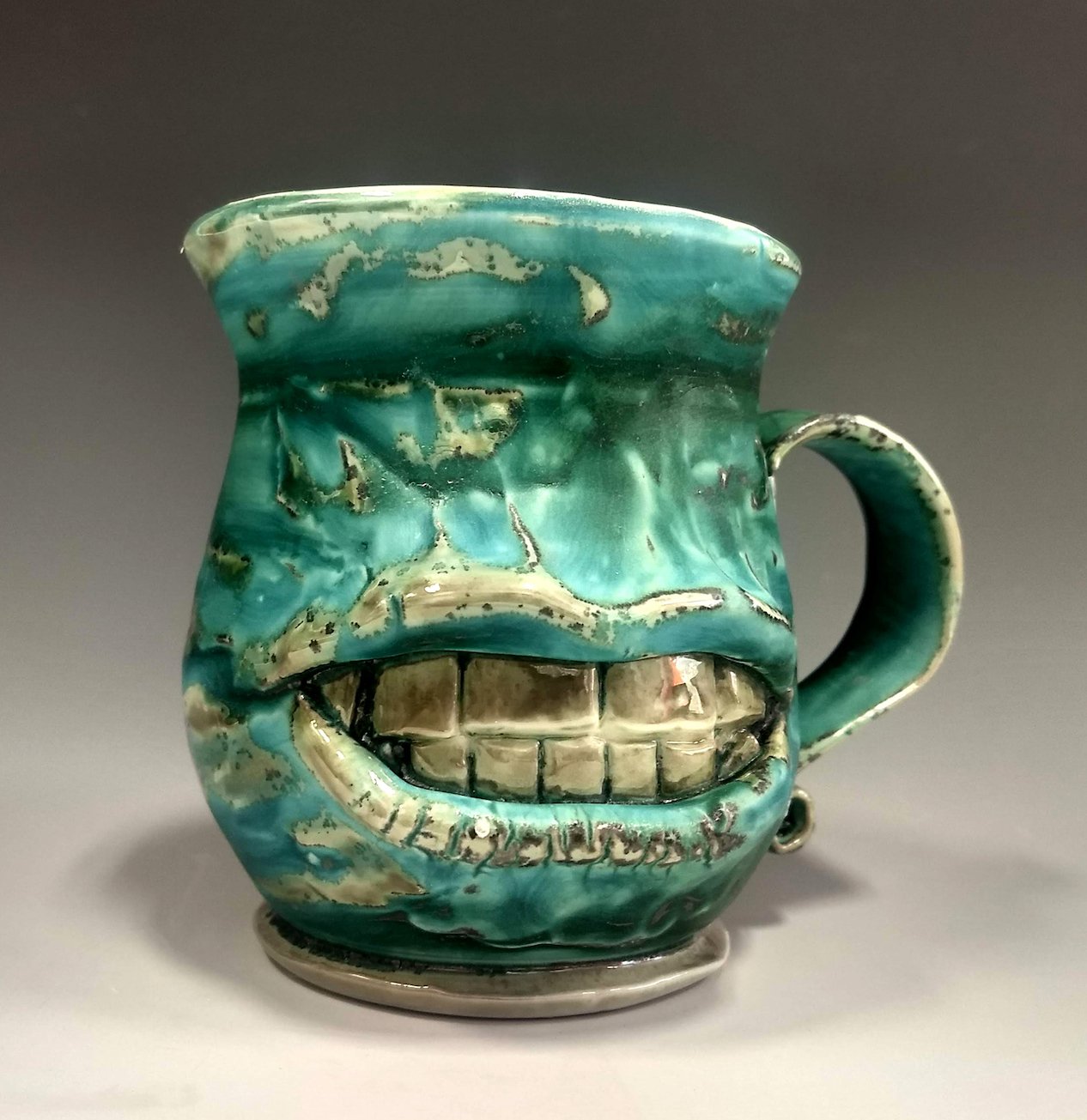    Silver-toothed Face Mug  , 5” x 3” x 3”, ceramic 