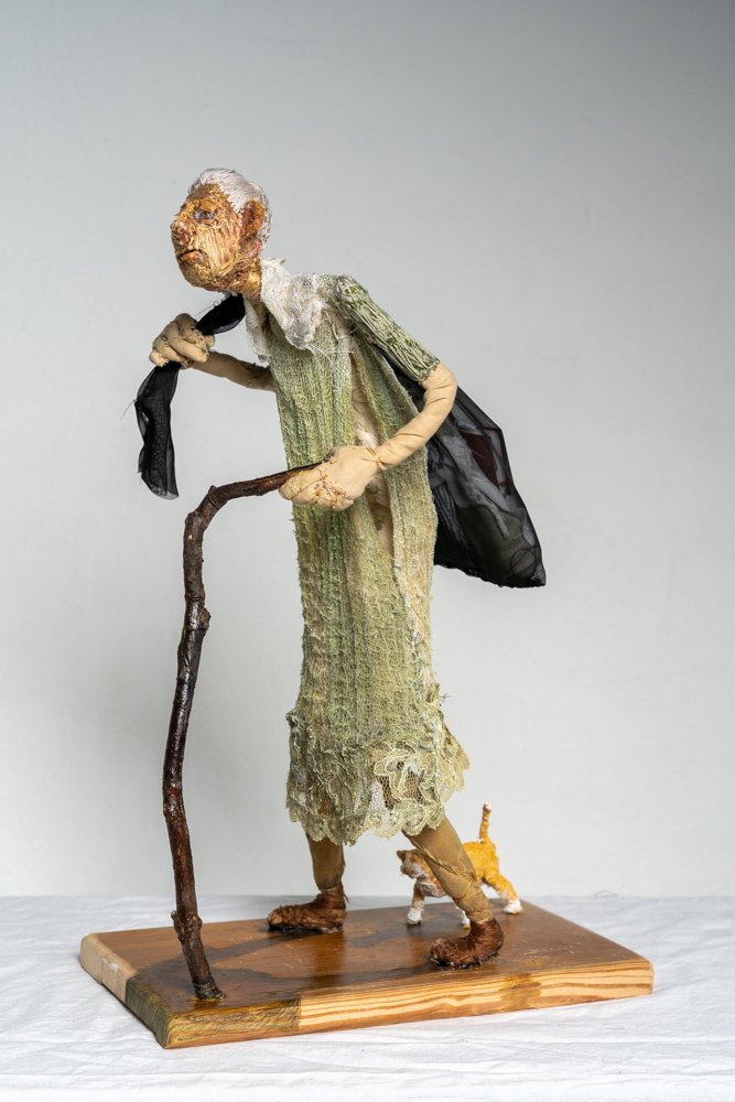    A Crone’s Odyssey  , 18” x 11.75” x 6.5”, polyester-filled fabric and thread, wood 