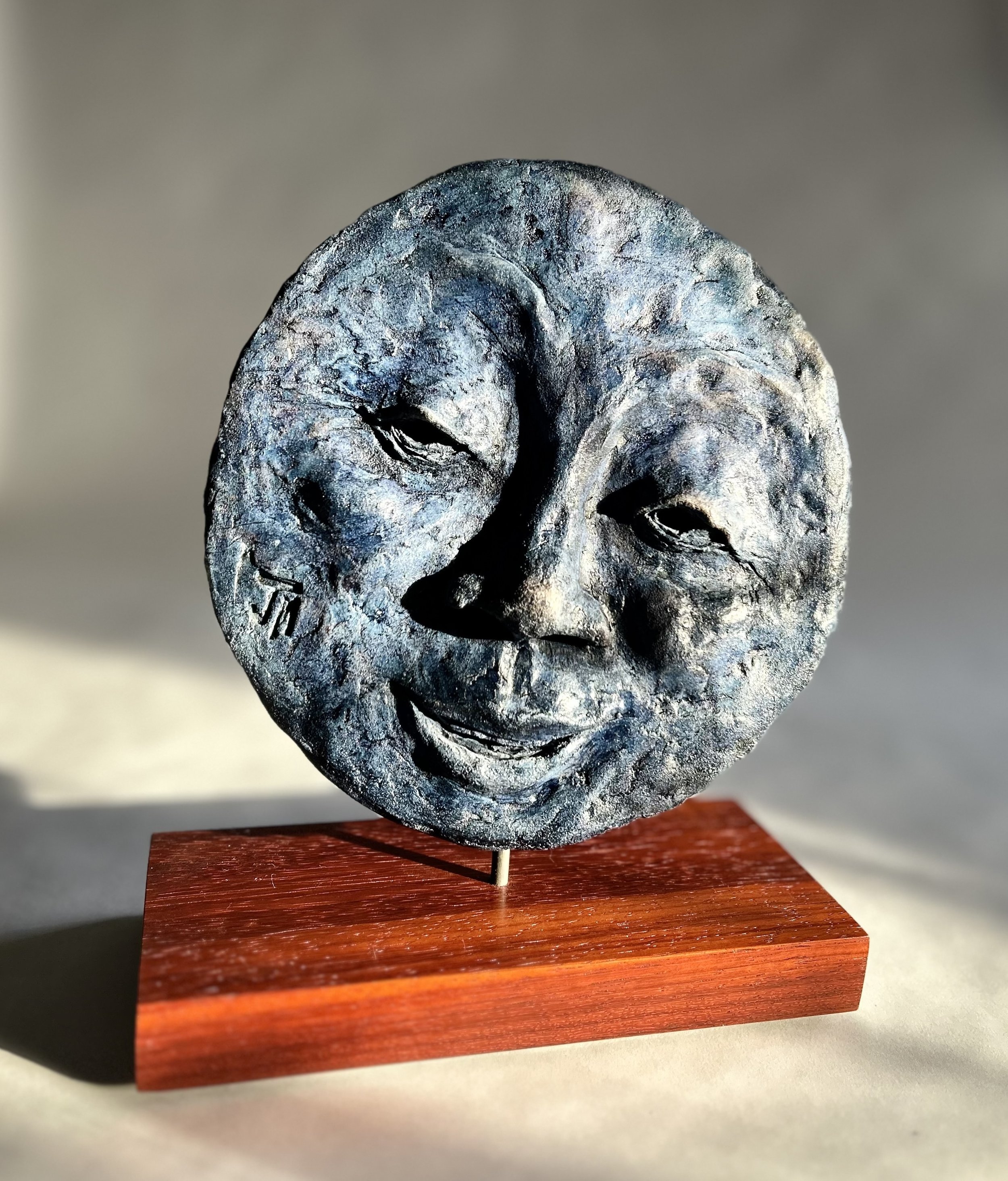    Blue Moon #2  , low fire clay, 9” D x 9.5” x 4.4” on Bloodwood base 