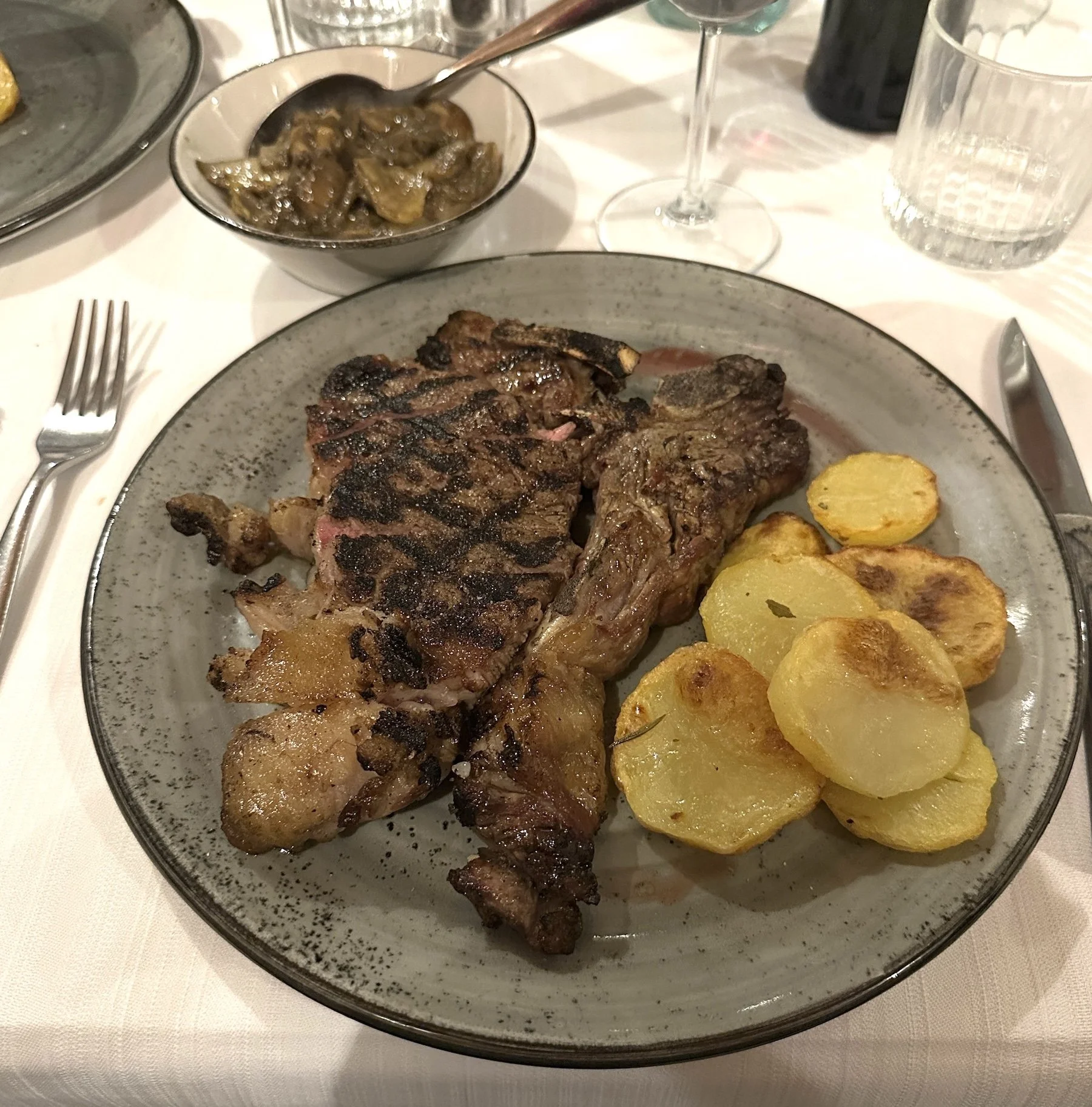  Florentine T-Bone Steak with roasted potatoes and porcini mushrooms 