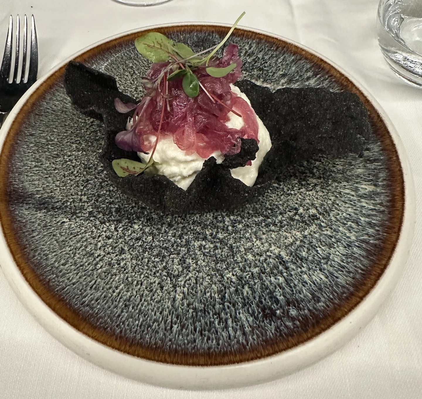  Creamed Stockfish with Honey Caramelized Red Onions in a Squid Ink Polenta Tuile 