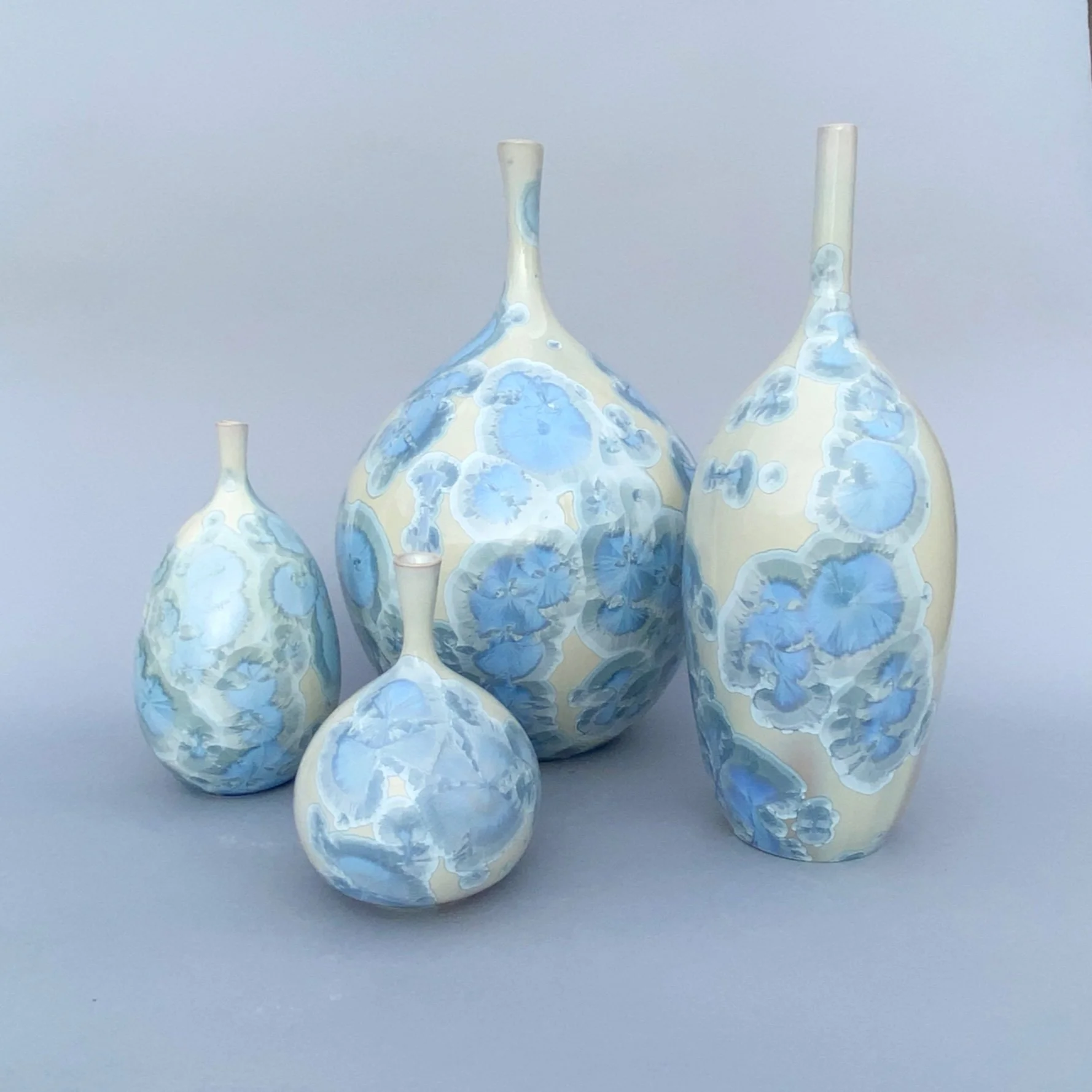    Light Blue Bottles  , porcelain, various sizes 