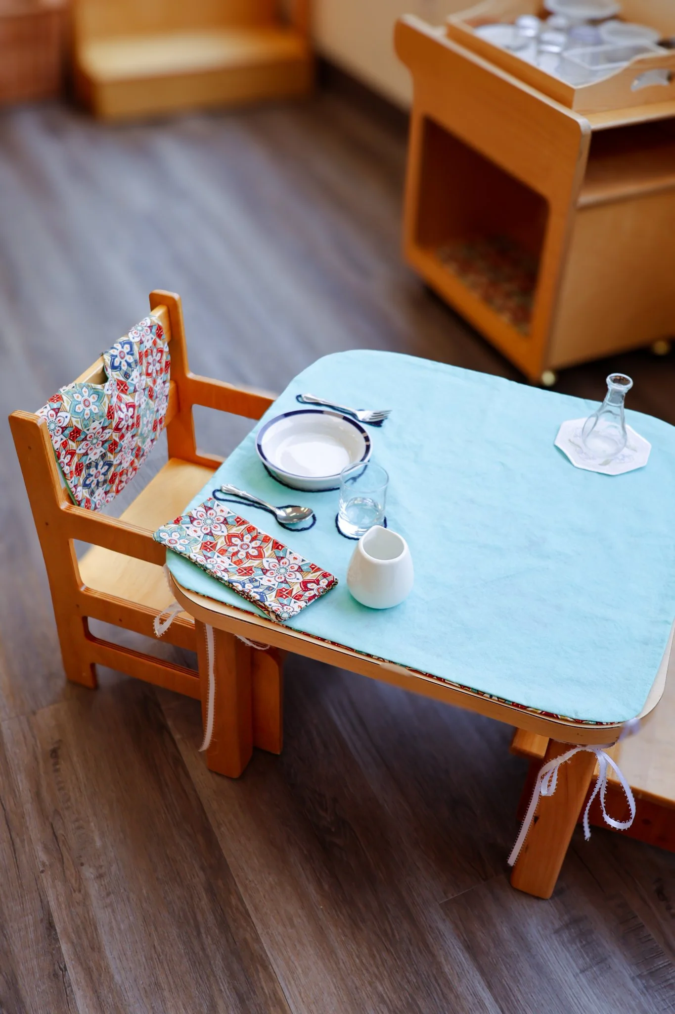 In the Montessori Nido (the infant community), even mealtime is part of the Prepared Environment.

This is the weaning set: an infant-sized table and chair, complete with real dishes, utensils, and a small glass. Here, the child begins the transition