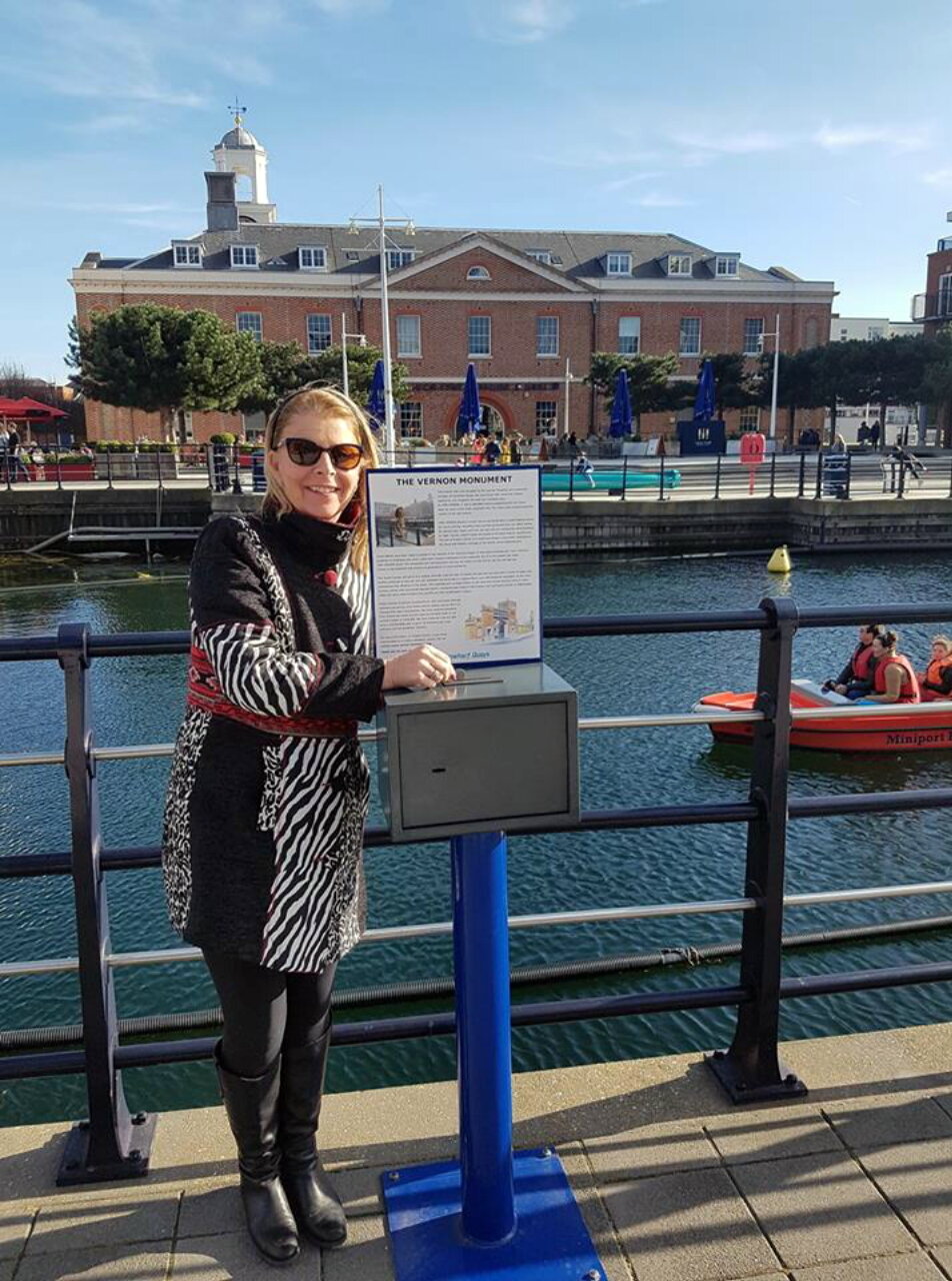 Project Vernon collection box with Vulcan Building in the background at Gunwharf Quays (formerly HMS VERNON)