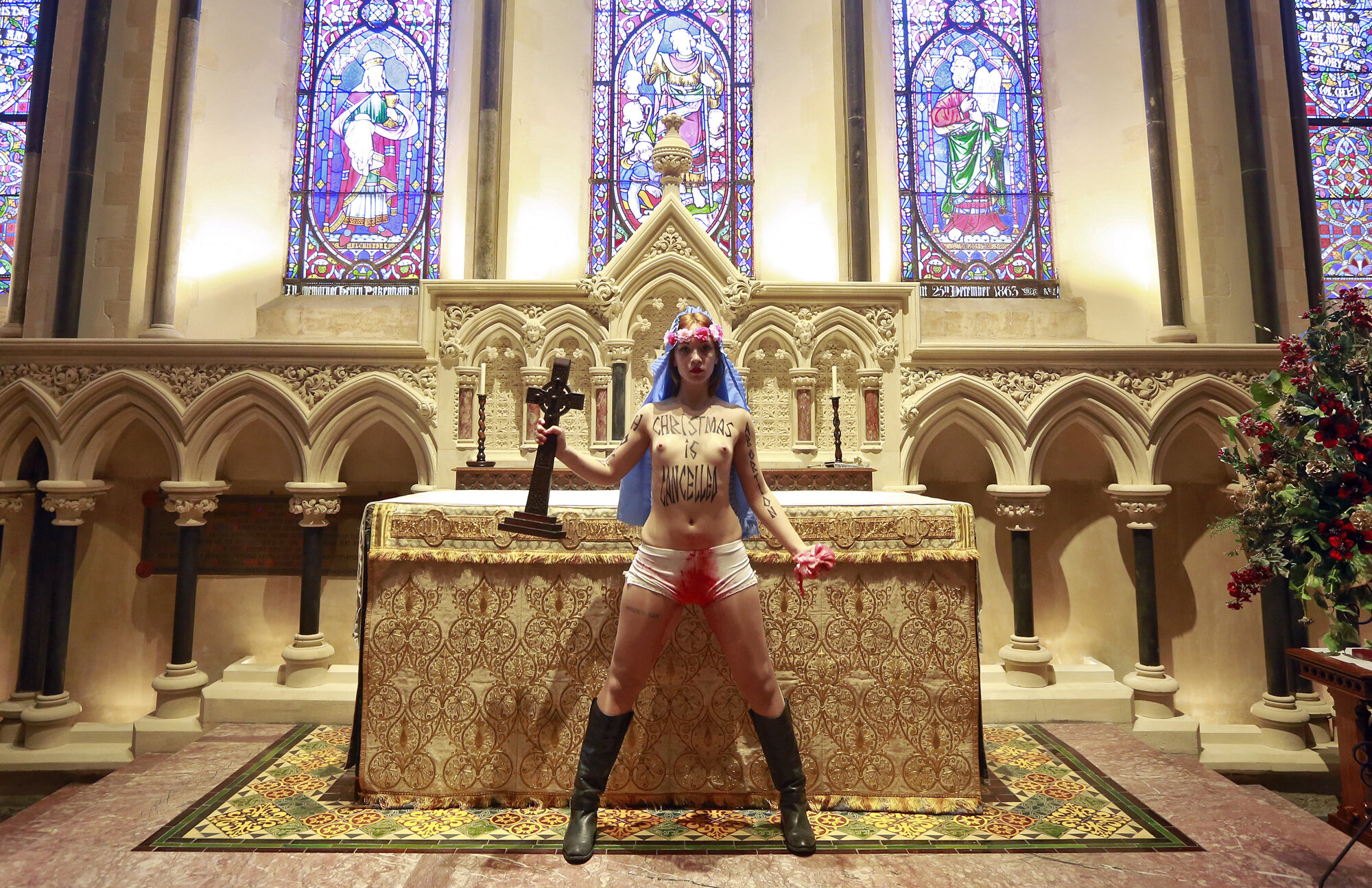 A member of Femen protests against Ireland’s abortion laws in St. Patrick’s Cathedral, Dublin, 2013.