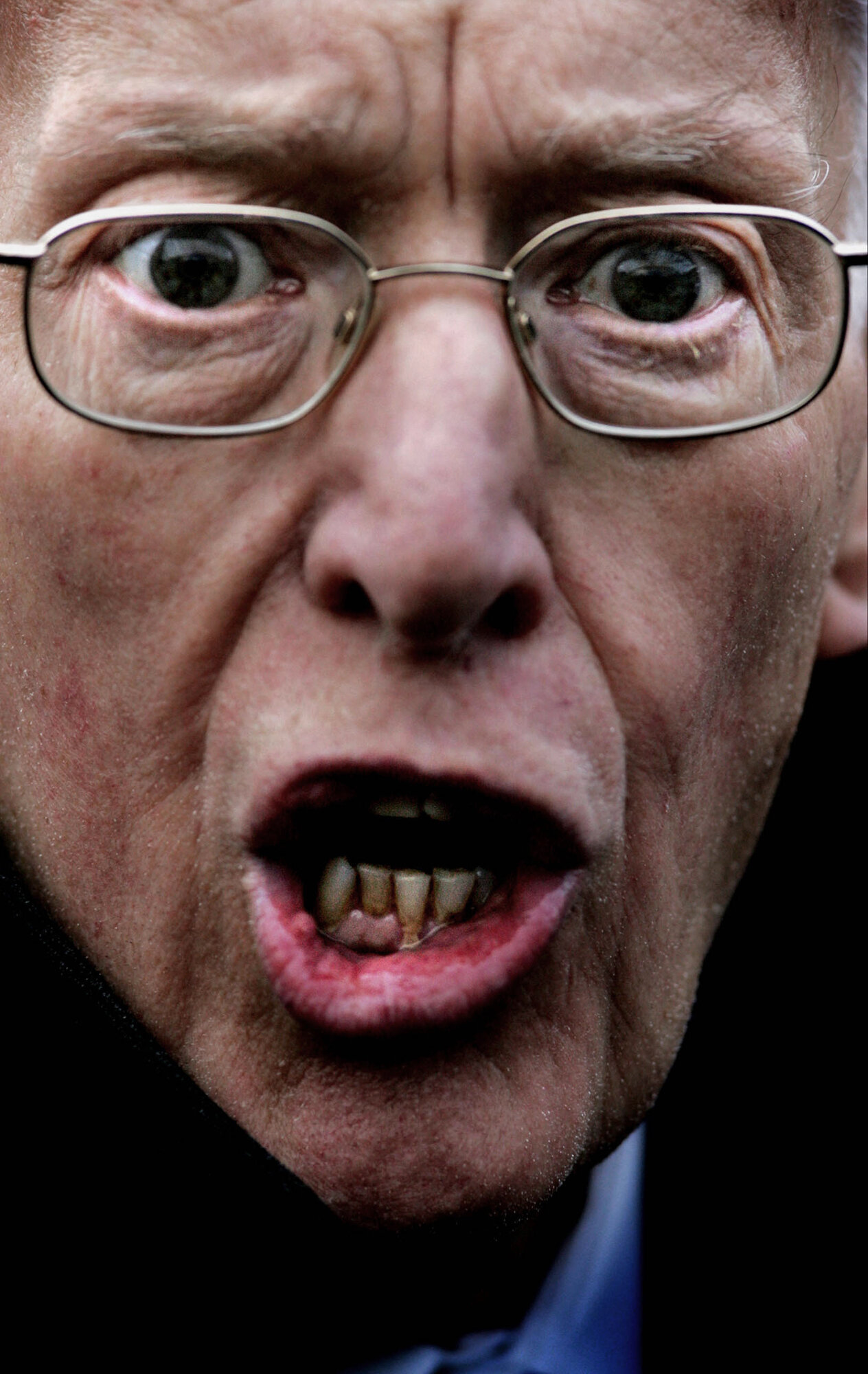 DUP leader Ian Paisley reacts during an interview where he demanded photographic evidence of IRA decommissioning at a press conference in Belfast, 2005.