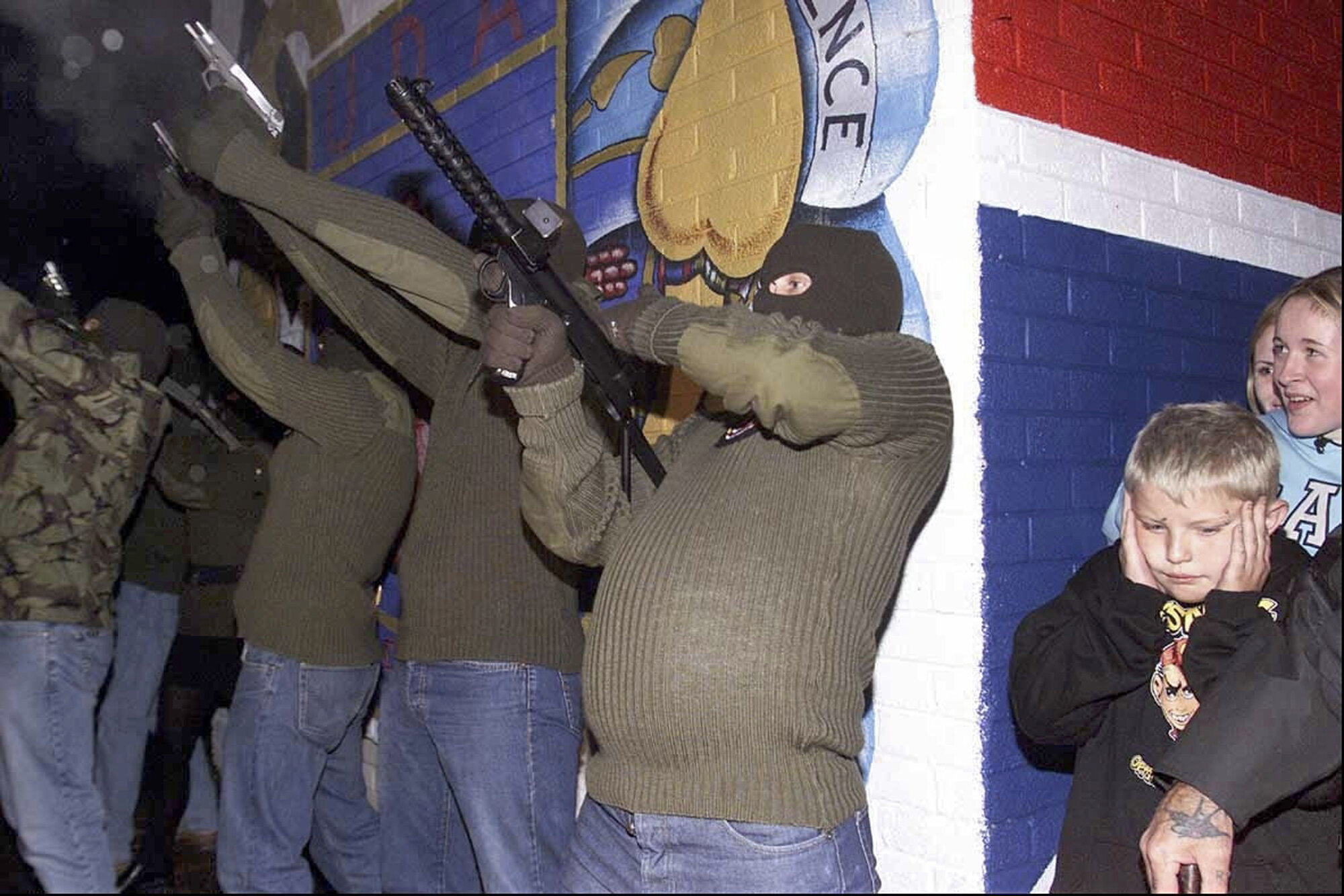 Members of the Loyalist Paramilitary group the Ulster Freedom Fighters (UFF) take part in a show of strength on Belfasts Shankill road, 2002.